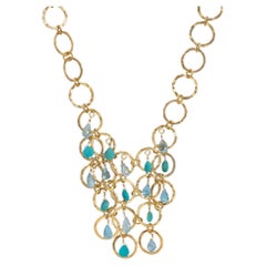 Gold Vermeil multi Hoop Bib Necklace with Turquoise and Blue Topaz Stones