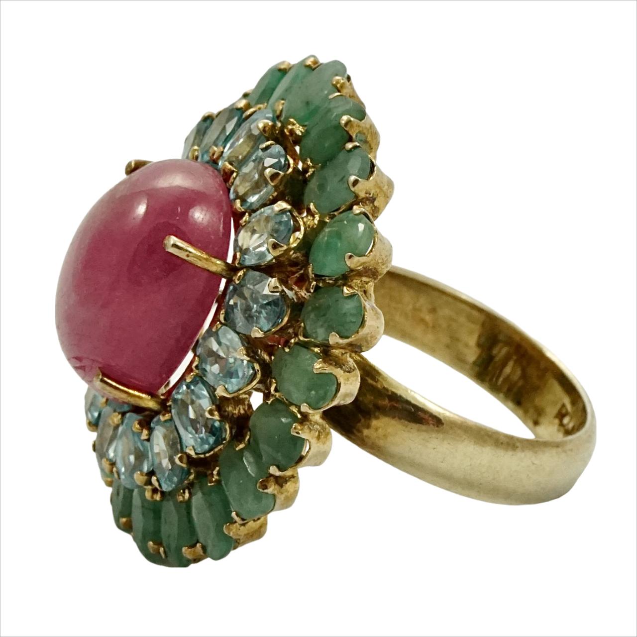 Fabulous gold vermeil on sterling silver ring, featuring a centre ruby surrounded with blue topaz and emeralds gemstones. Ring size UK P 1/2, US 7 3/4, inside diameter 1.9 cm / .74 inch, and measuring length 3.1 cm / 1.2 inches by 2.9 cm / 1.1