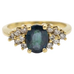 Gold vintage ring with oval 1.40ct blue sapphire and diamonds