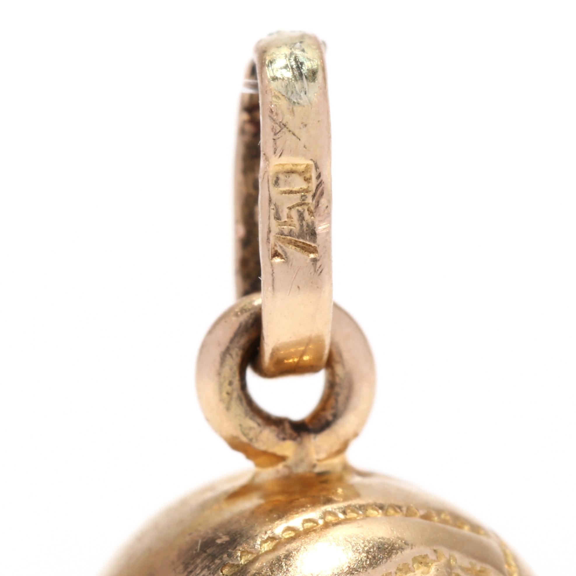 A vintage 18 karat yellow gold volleyball charm. This small charm features a semi solid sphere with engraved detailing depicting a volleyball motif and with a thin bail.

Length: 5/8 in.

Width: 3/8 in.

Weight: 1 dwts.



Ring Sizings &