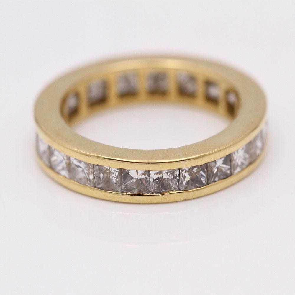 Yellow gold ring for woman  24 princess cut diamonds with a total weight of approx. 3.60 cts., in G/VS quality  Size 12, this ring does not allow for size modification.  18kt yellow gold  5.96 grams.  This wedding ring is in good condition.  Second