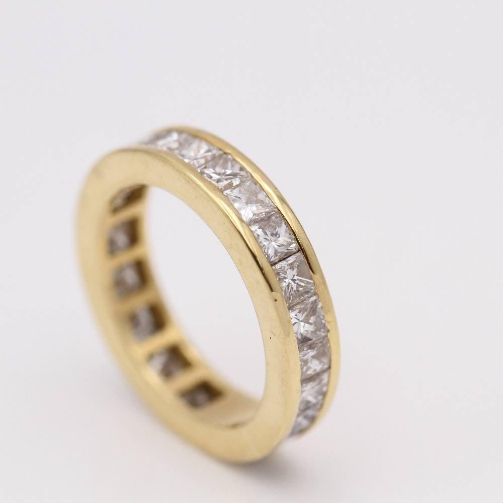 Yellow gold ring for woman  24 princess cut diamonds with a total weight of approx. 3.60 cts., in G/VS quality  Size 12, this ring does not allow for size modification.  18kt yellow gold  5.96 grams.  This wedding ring is in good condition.  Second