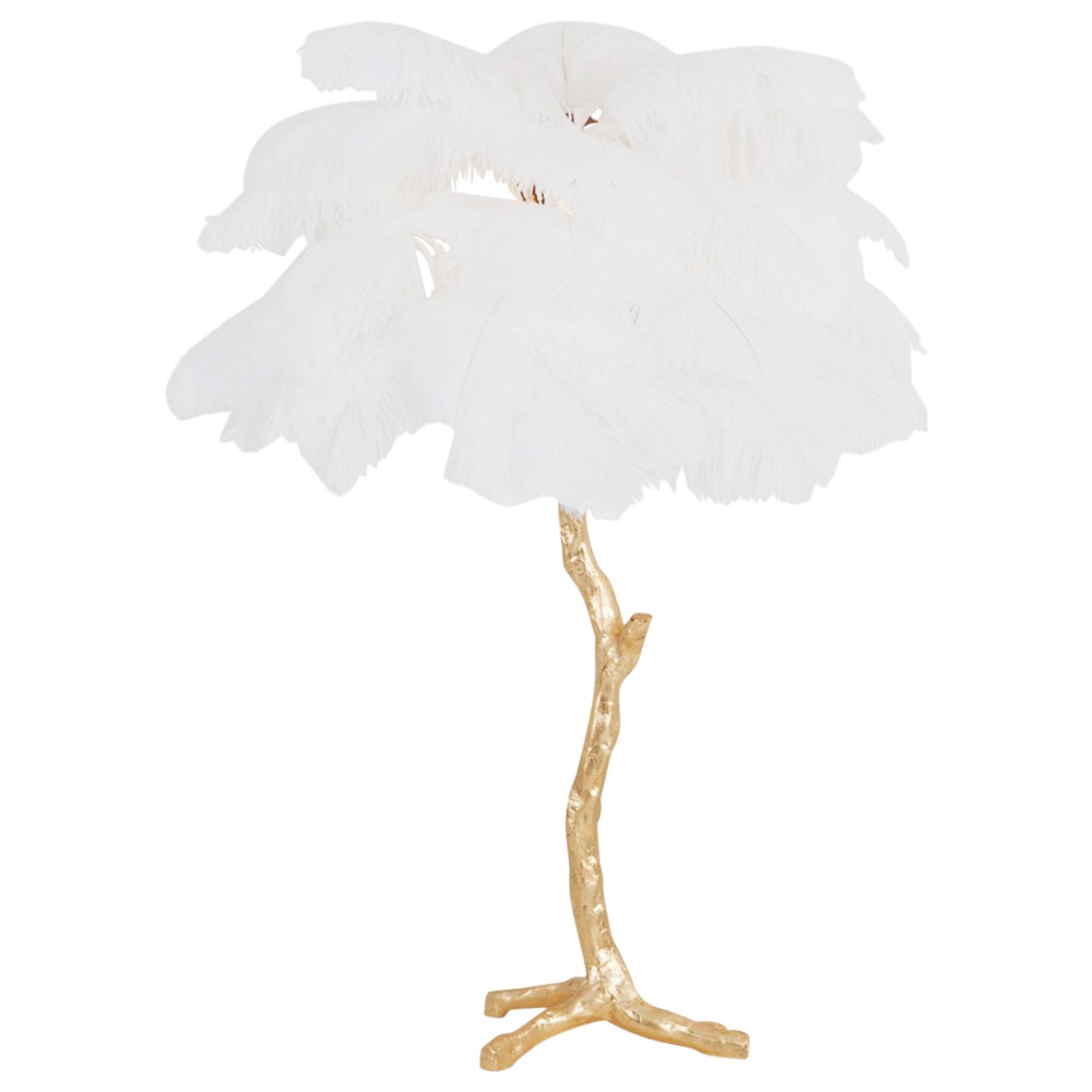 Contemporary Hollywood Regency lamp with golden resin stem and white colored ostrich feathers

Decorative luxury piece that fits well in an eclectic Hollywood Regency inspired metropolitan interior

We can also offer the larger floor lamp model.