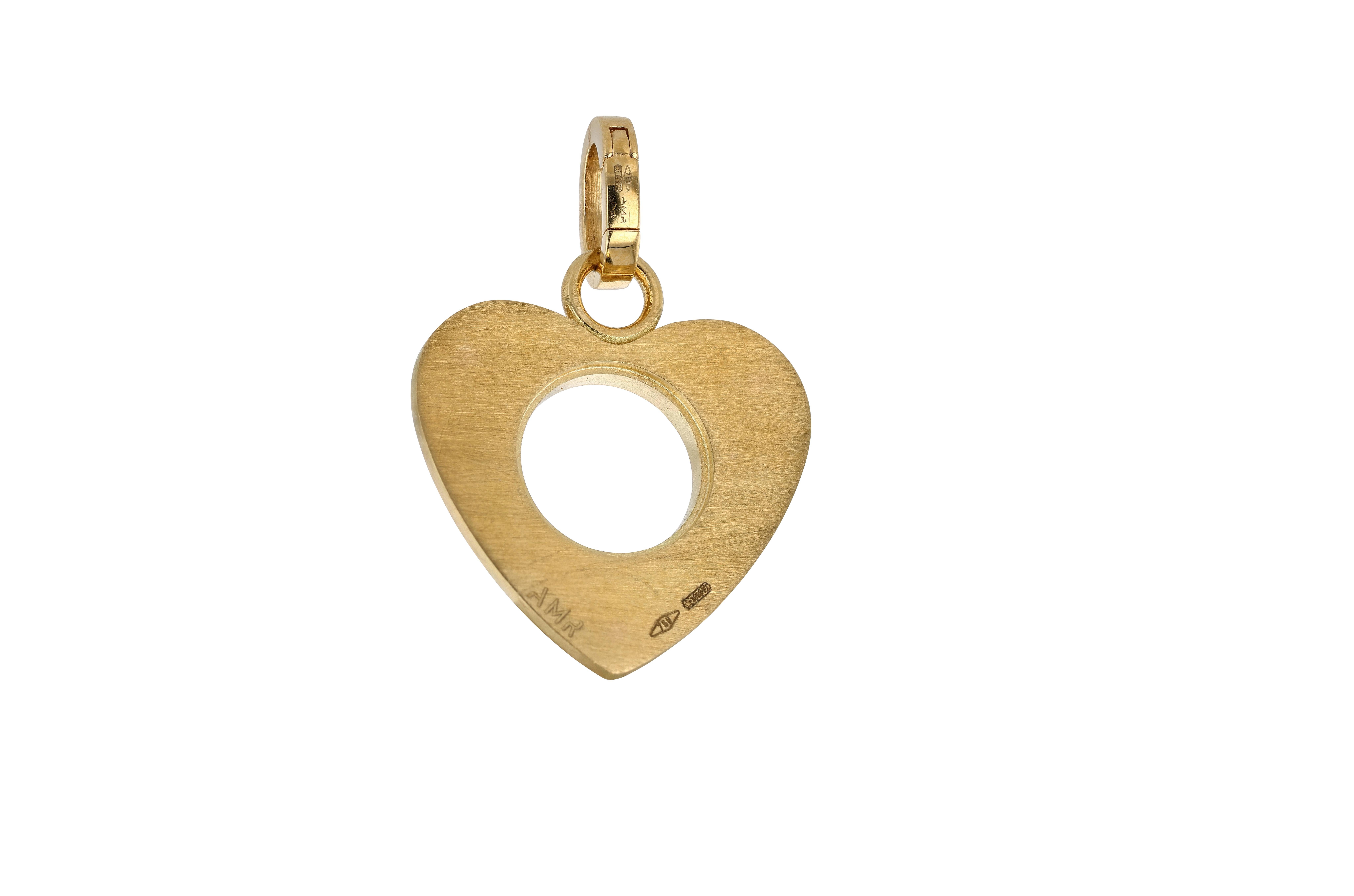 A very cute and highly fashionable 18 karat yellow and white gold solid heart charm, embellished with three diamond set star motifs and open in the center with a diamond border surrounding the perforated portion. The charm is both high polish and
