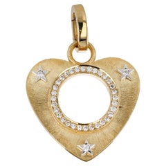 Charm a forma di cuore in oro, oro bianco e diamanti