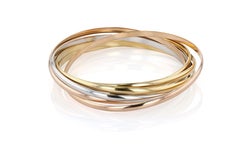 Bracelet trinité en or, or blanc et or rose à sept rangs de Cartier