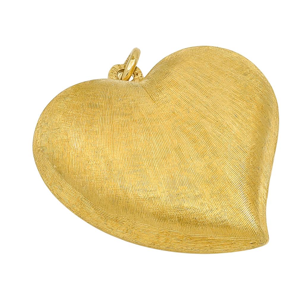 Luminous figural witch's heart.  Softly shimmering textured 14K yellow gold finish.  There is a well-defined border, which emphasizes the silhouette of the witch's heart.  1 1/4