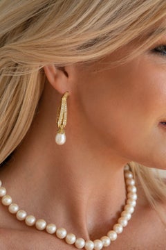 @Eliania Rosetti earrings in 18k gold, freshwater pearls and 1.07 carat diamonds