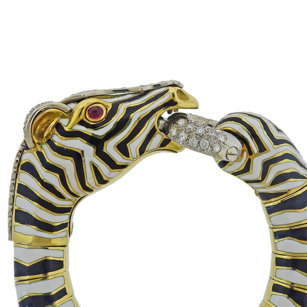 Impressive 18k yellow and white gold  zebra bracelet, decorated with enamel, ruby eyes and approx. 3.40ctw in diamonds. Bracelet will fit approx. 6.5