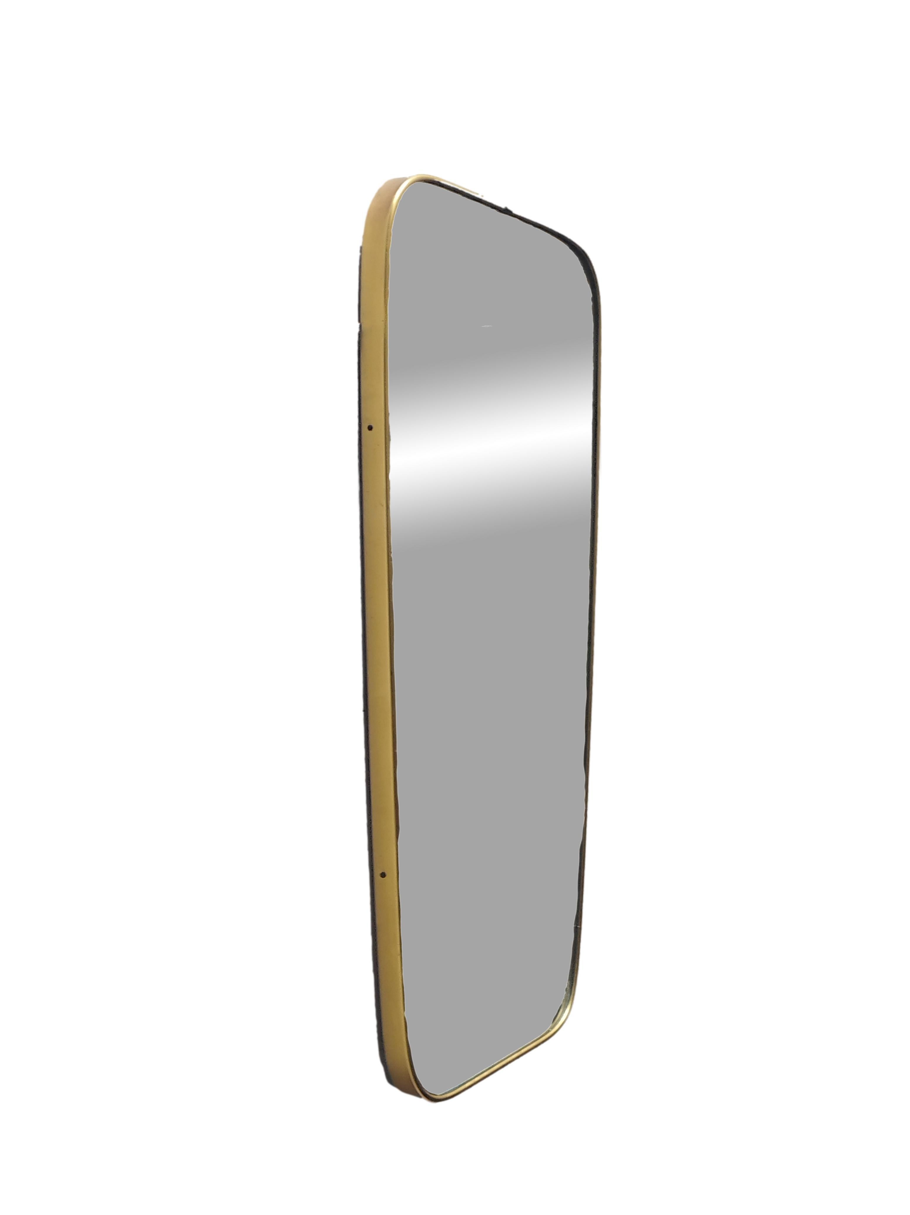 This is a beautiful and very large gilt aluminum long mirror from the 1950s. 
