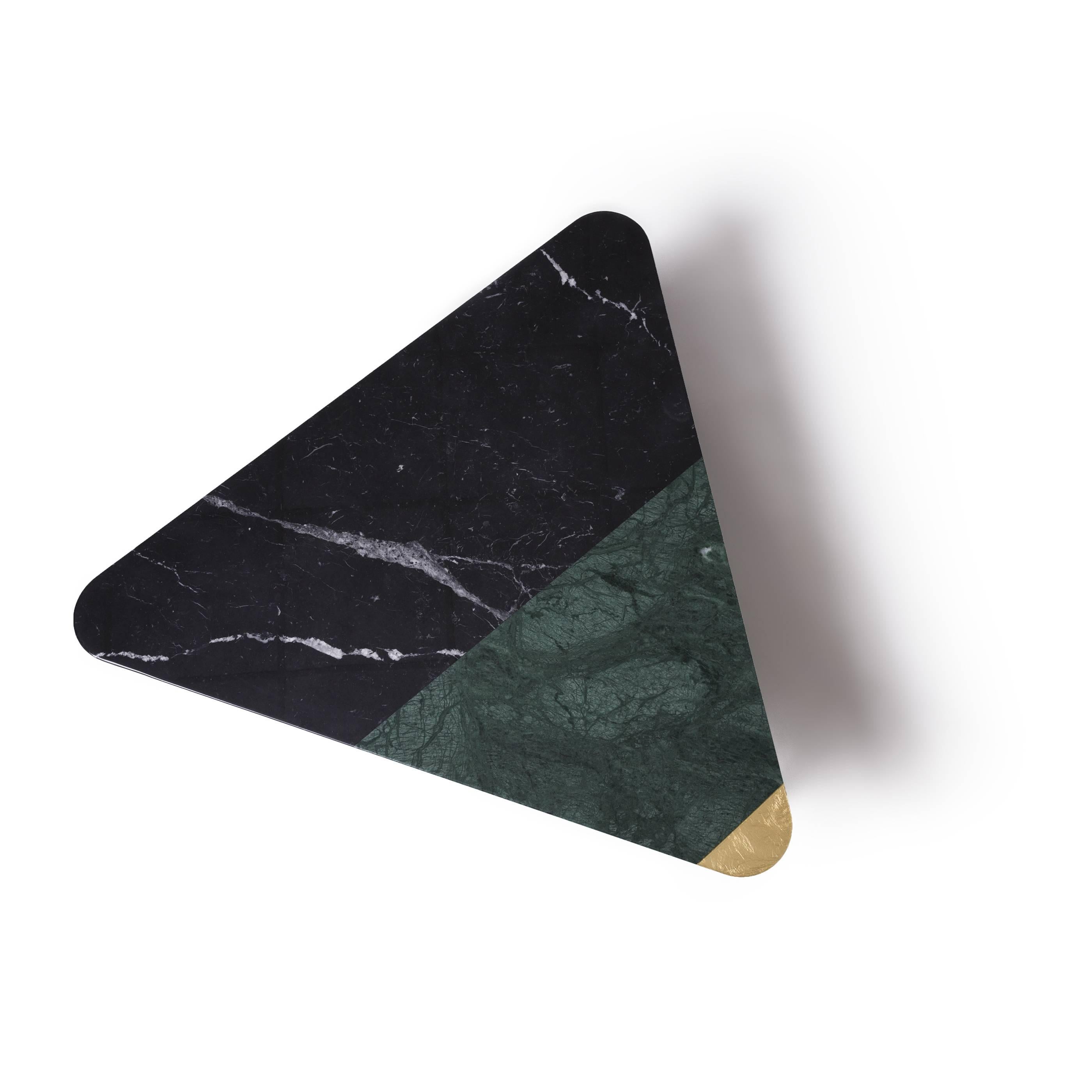Golden archer coffee table by Alex Mint

Marble-top and brushed bronze. Nero Marquina- Verde Guatemala - Gold Leaf

The materials
Marble and stone collected from all over the world and combined carefully with timber and metal details are the