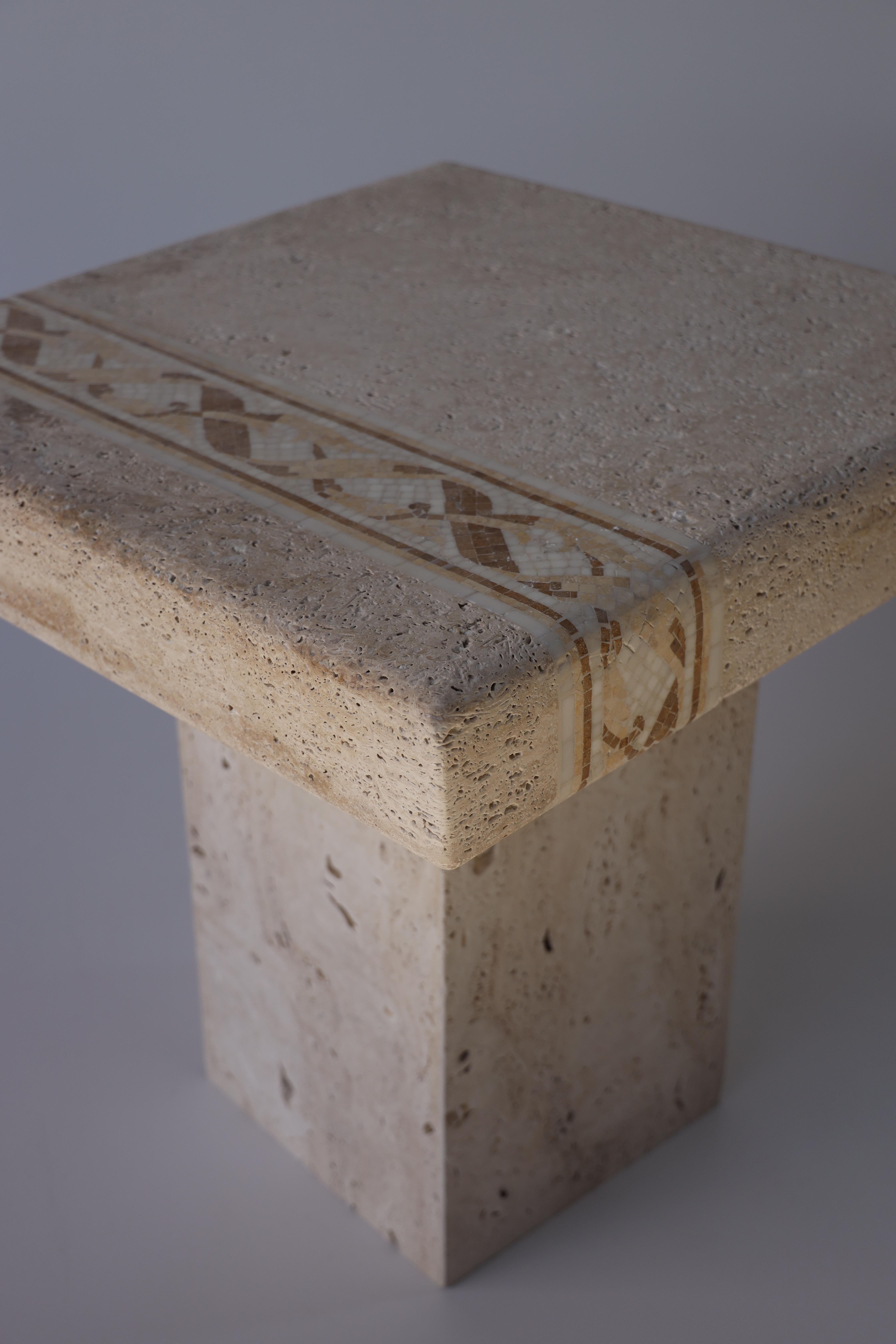 Introducing a work of art that transcends time and trends - our Travertine and Marble Mosaic Coffee Table. This exquisite piece of furniture seamlessly combines the rustic charm of travertine with the opulent allure of marble mosaic, bringing