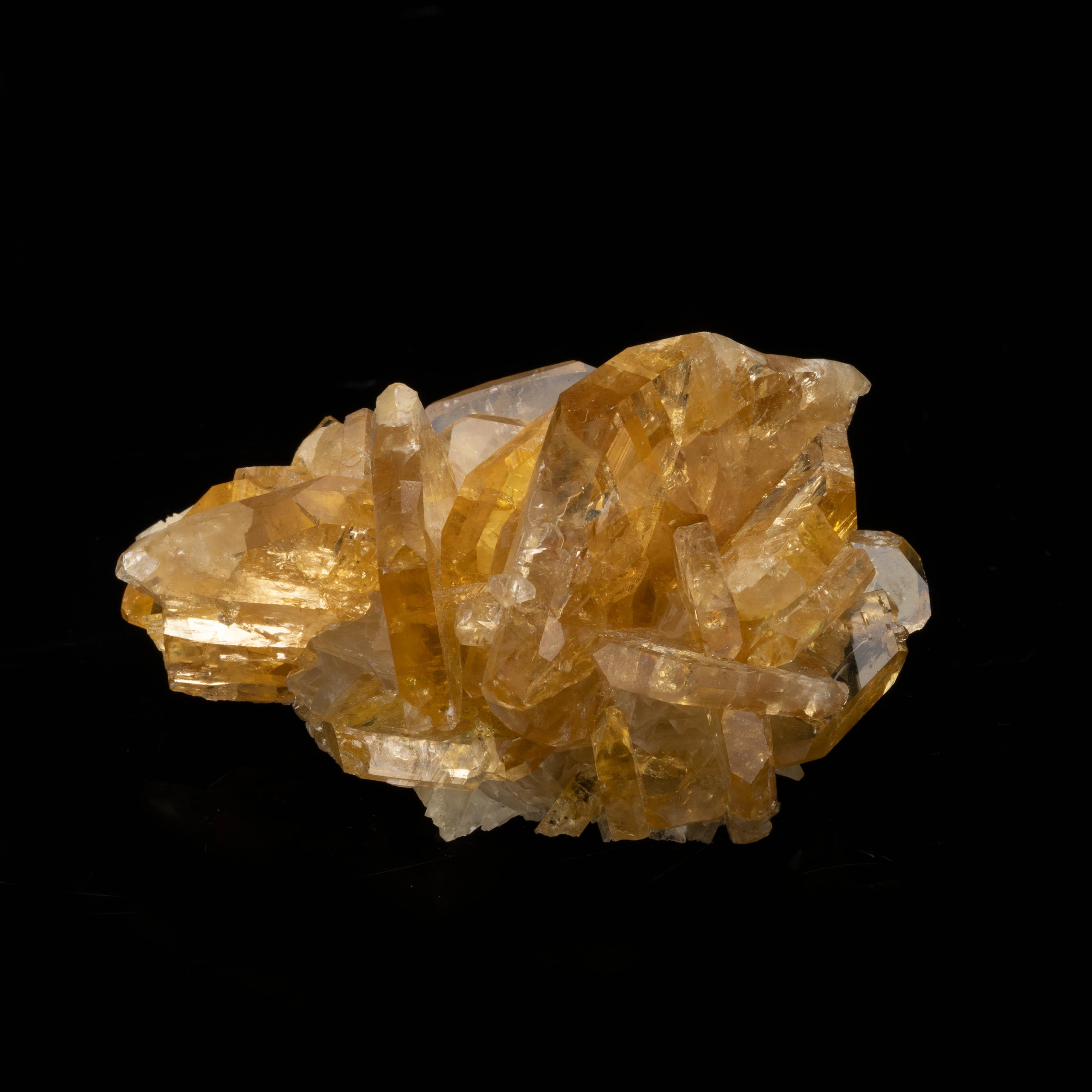 From Nevada's Meikle Mine, this excellent quality golden barite features stellar translucency and harbors rainbows. This cluster of lustrous and fully formed tabular-rhombohedron crystals displays a beautiful amber hue. A handsome