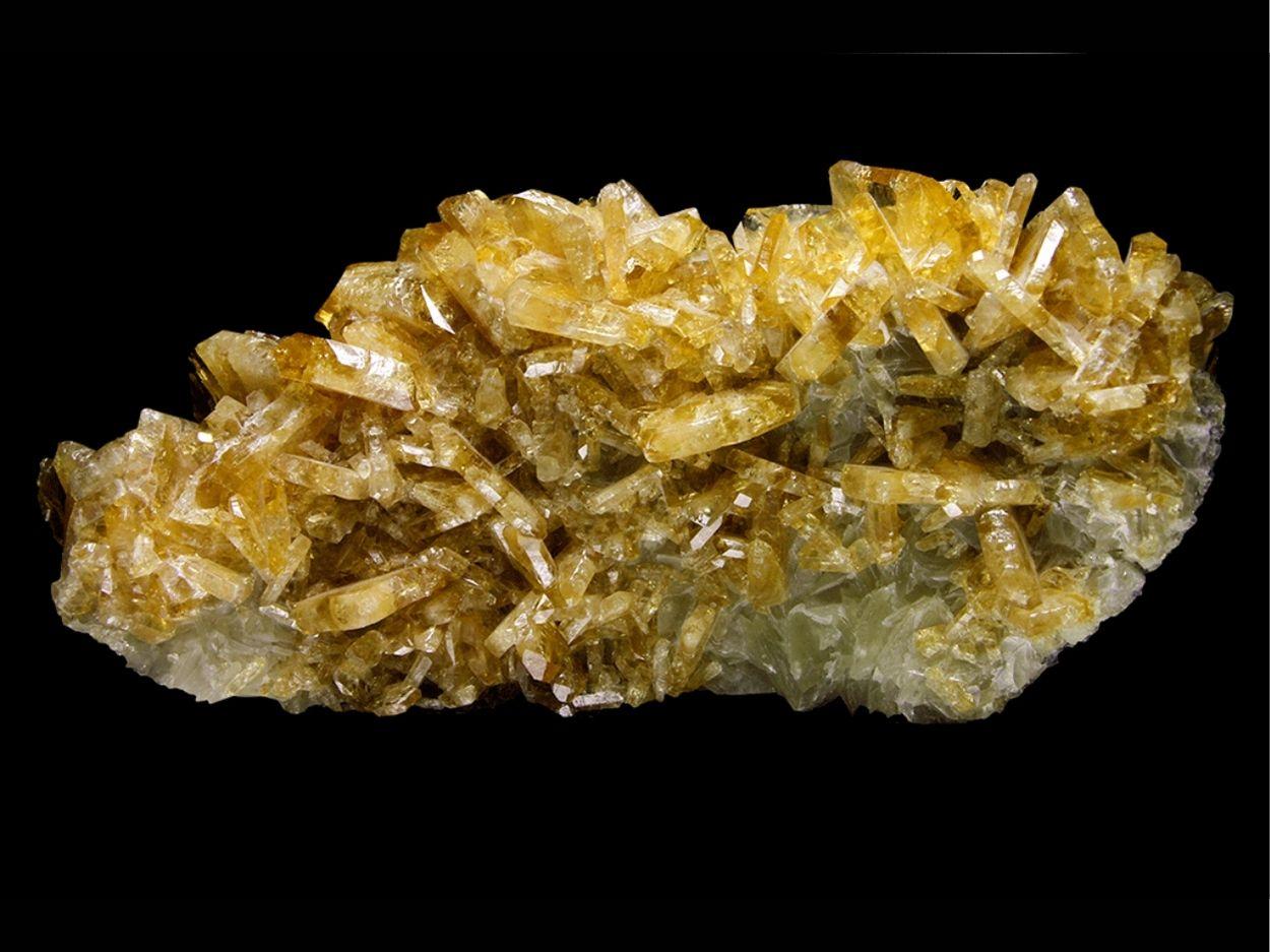 From Meikle Mine, Elko County, Nevada

Large rich cluster of golden yellow translucent bladed intersecting crystals of barite over calcite matrix. The barite crystals are glassy and translucent, with deep color.

 
10.95 lbs, 11'' x 5'' x 4''