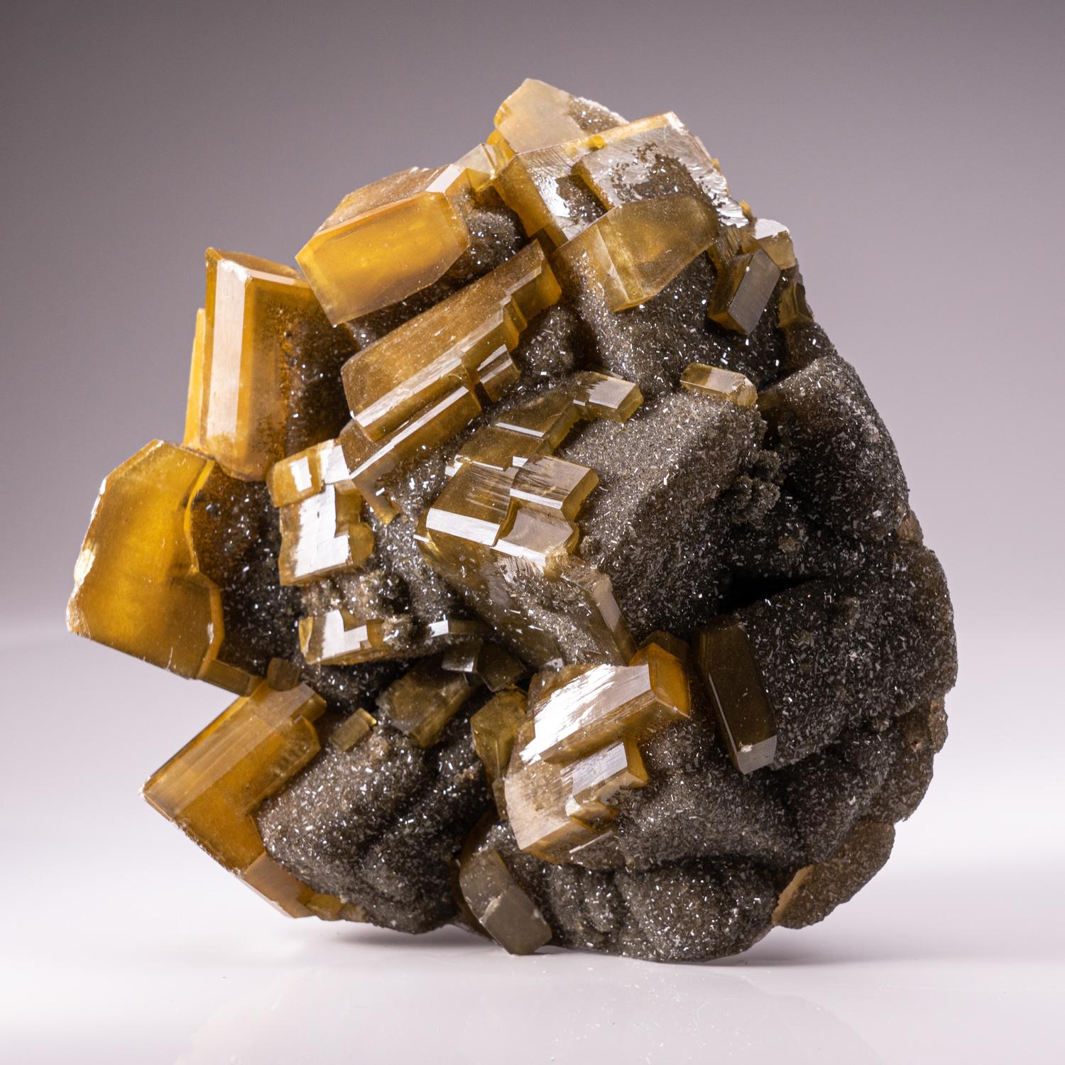 Golden Barite with Marcasite Crystals from Nandan County, Hechi, Guangxi, China.

Complex intersecting formation of lustrous gem translucent golden barite crystals with lustrous faces and sharp modified rhombic faces.

Weight: 6.8 lbs,