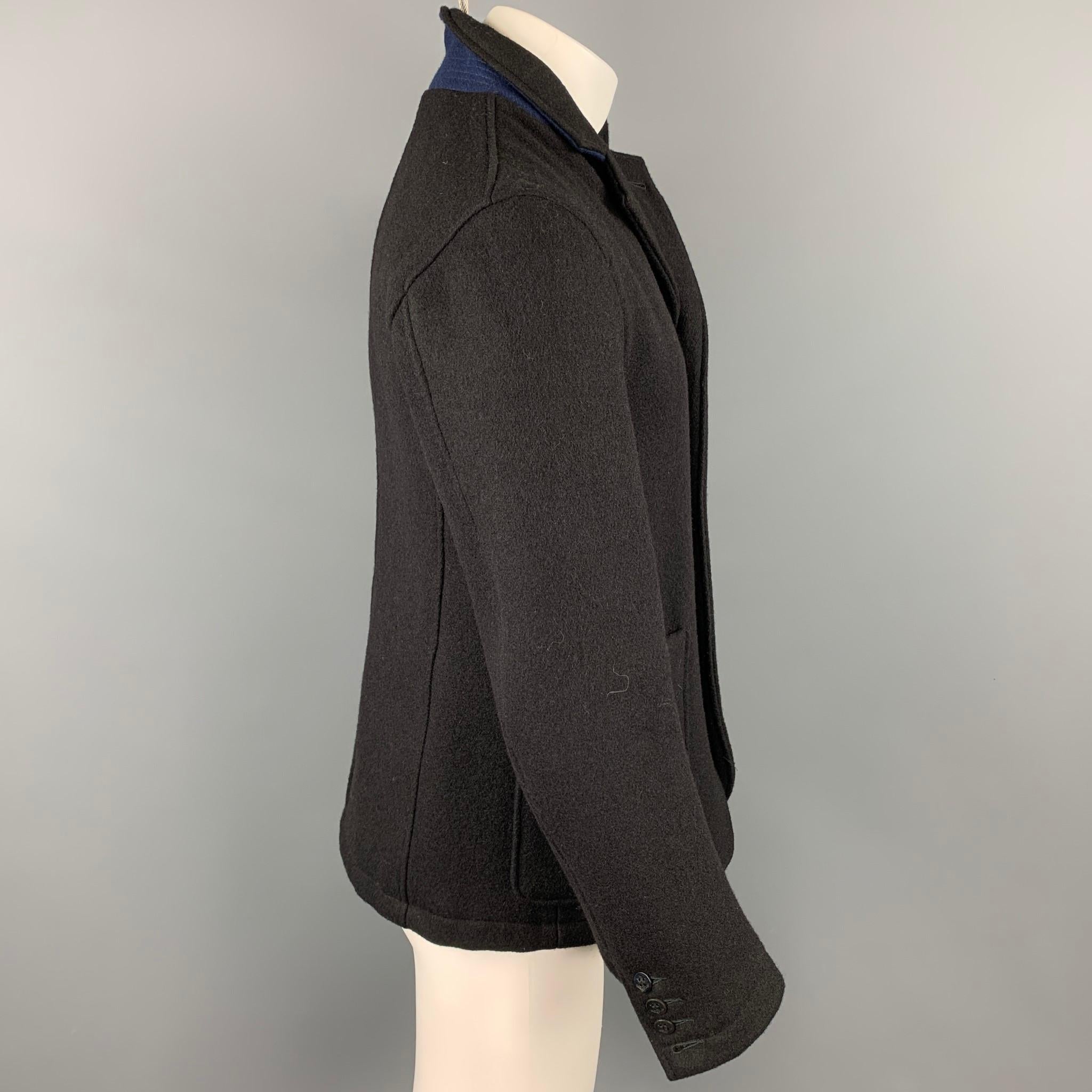 GOLDEN BEAR for UNIONMADE coat comes in a black wool / nylon featuring a strap collar, patch pockets, and a buttoned closure. Made in USA.

Very Good Pre-Owned Condition.
Marked: M

Measurements:

Shoulder: 18 in.
Chest: 39 in.
Sleeve: 25.5