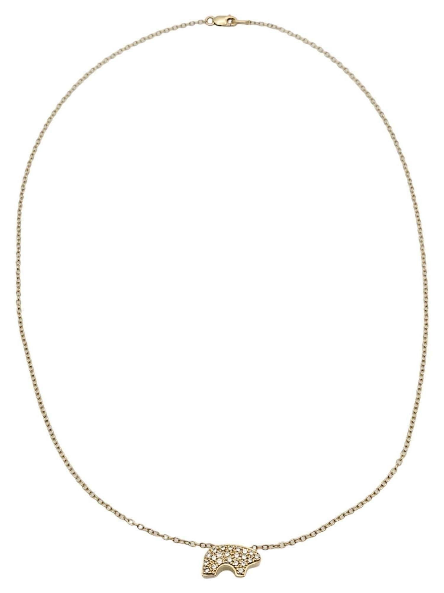This elegant pendant necklace was designed by The Golden Bear. Founded in Vail, Colorado, in 1975, the Golden Bear store's distinctive little bruin would become recognized as 