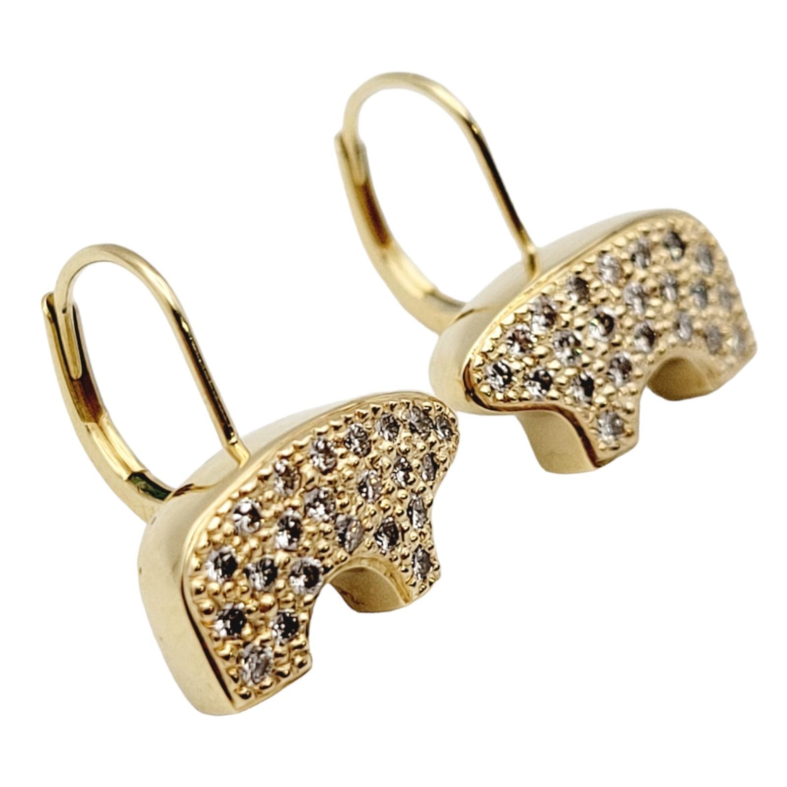 This beautiful pair of lever-back earrings were designed by The Golden Bear. Founded in Vail, Colorado, in 1975, the Golden Bear store's distinctive little bruin would become recognized as 
