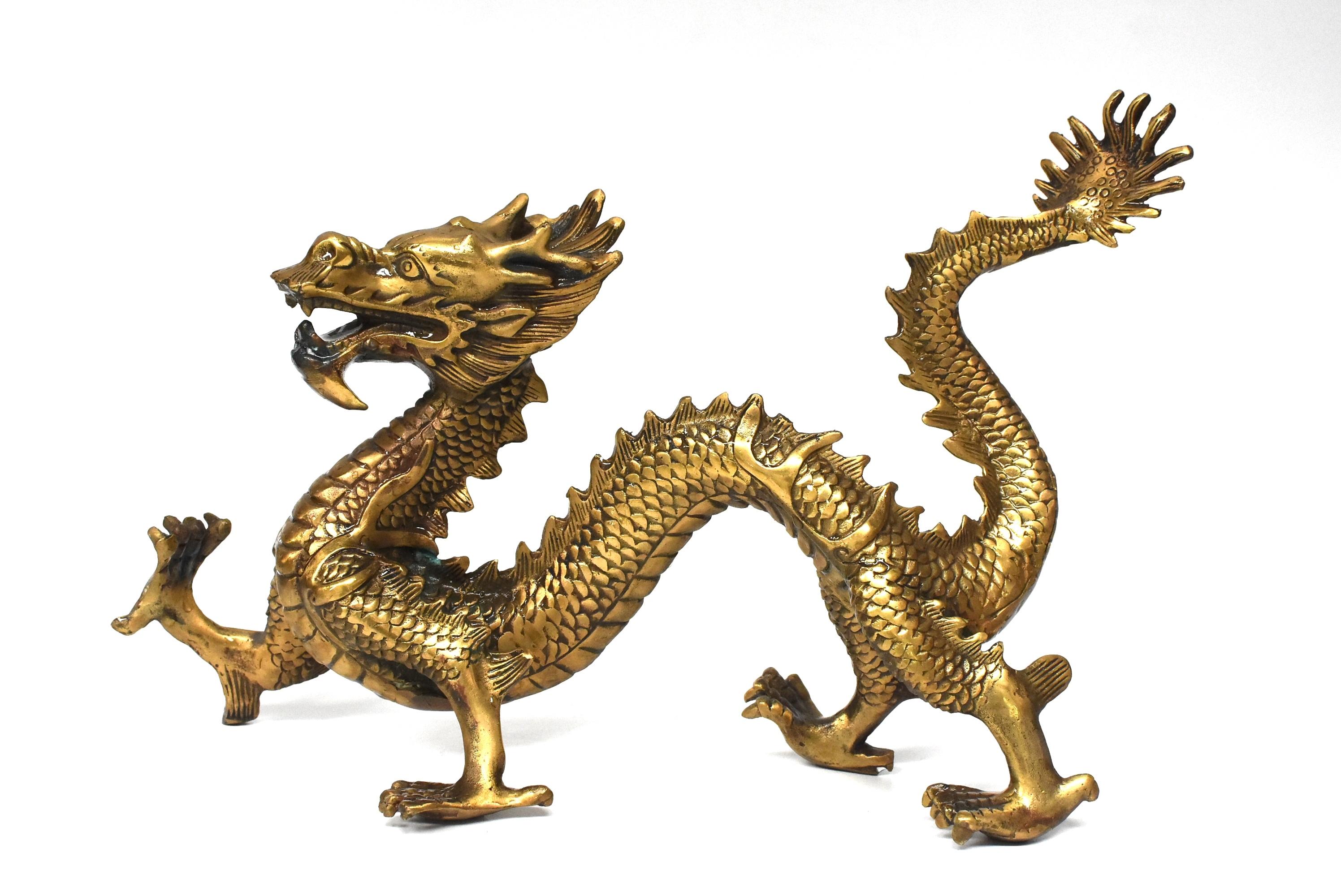 A beautiful brass dragon with fantastic depiction of horns, scales and paws. The dragon is the sign of Chinese Emperor, it symbolizes power and prosperity. A wonderful piece as a display, a feng shui tool and add to your collection.