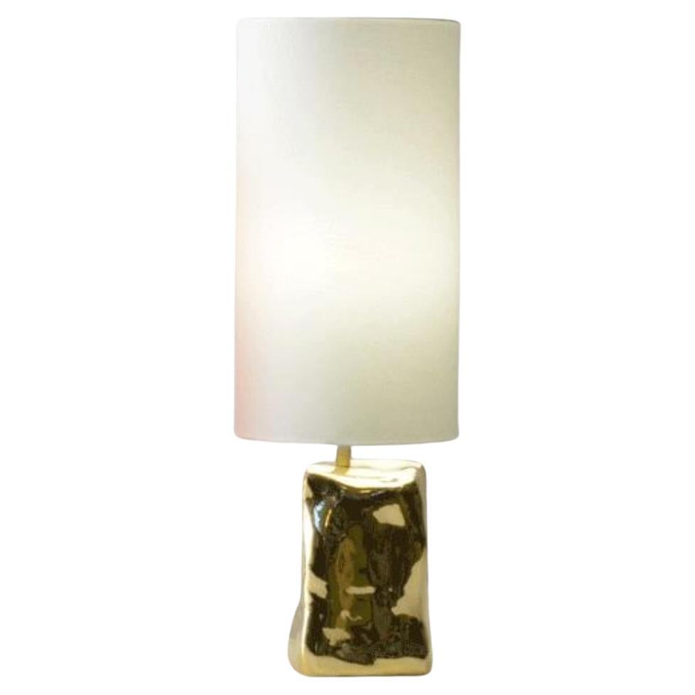 Golden brazilian contemporary table lamp made of cast bronze For Sale