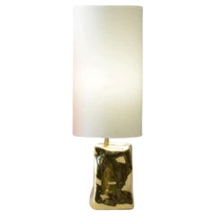 Golden brazilian contemporary table lamp made of cast bronze