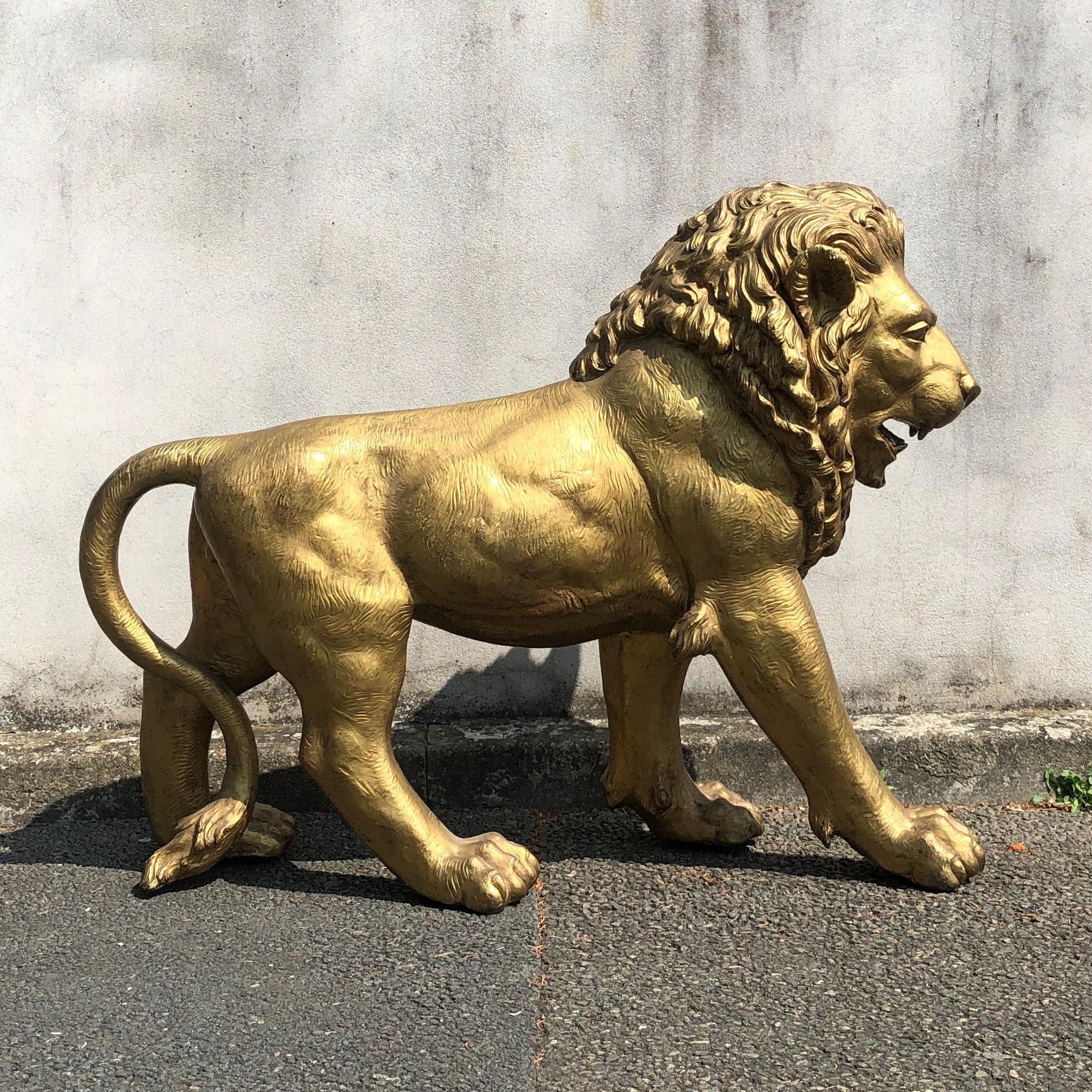 Golden bronze animal sculpture representing a lion from Paris from 1940s

Gold lacquered golden bronze lion, from Paris from mid-20th century. Please note details such as the face, the foot and the tail. They are finely engraved and worked to give