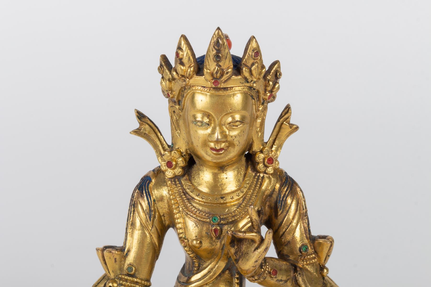 Golden bronze Buddha, China, 17th-18th century
Measures: H 14cm, W 10cm, D 9cm.