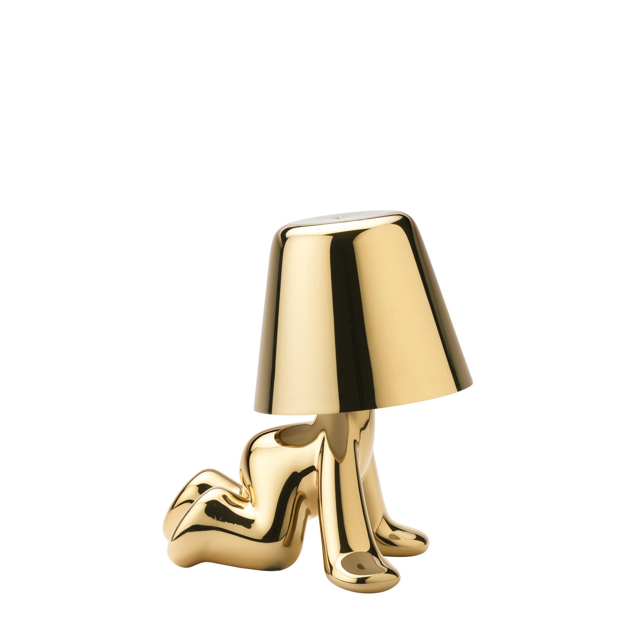 This Golden Brothers is called Ron.

Designed by Stefano Giovannoni, Golden Brothers is a family of lamp-characters which, reflecting a soft light on their body, enhance the plasticity and fluidity of the silhouette. The Golden Brothers, assuming