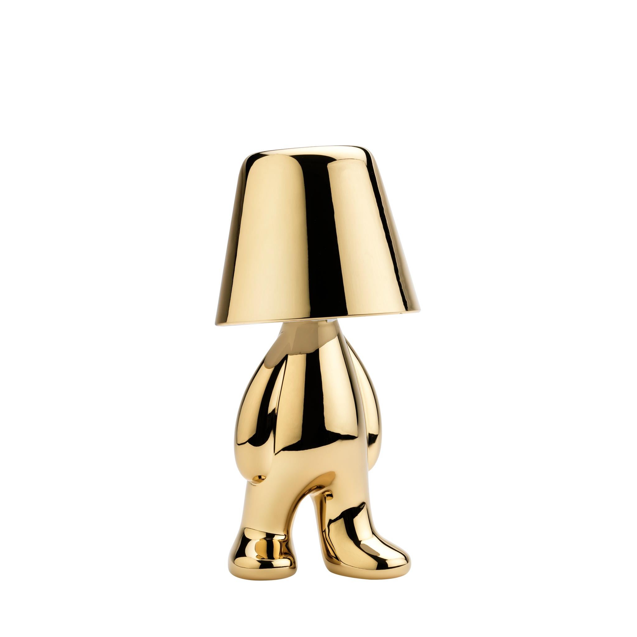 This Golden Brothers is called Tom.

Designed by Stefano Giovannoni, Golden Brothers is a family of lamp-characters which, reflecting a soft light on their body, enhance the plasticity and fluidity of the silhouette. The Golden Brothers, assuming