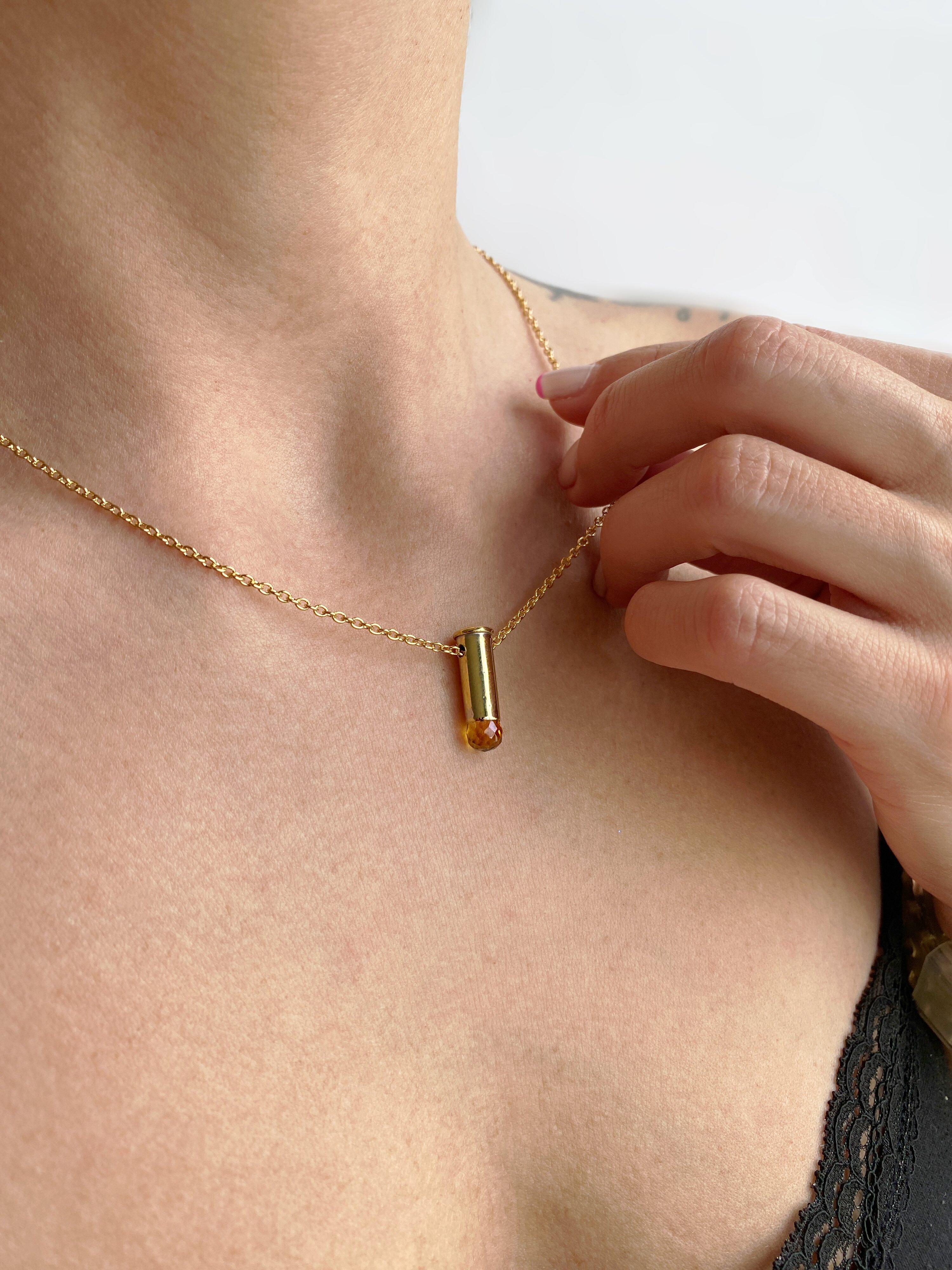 This captivating necklace features a 22 caliber gold filled bullet casket set with a natural Citrine briolette. This piece is from the “Peace” collection by Sebastian Jaramillo, commemorating the signing of peace between the Colombian guerrillas and
