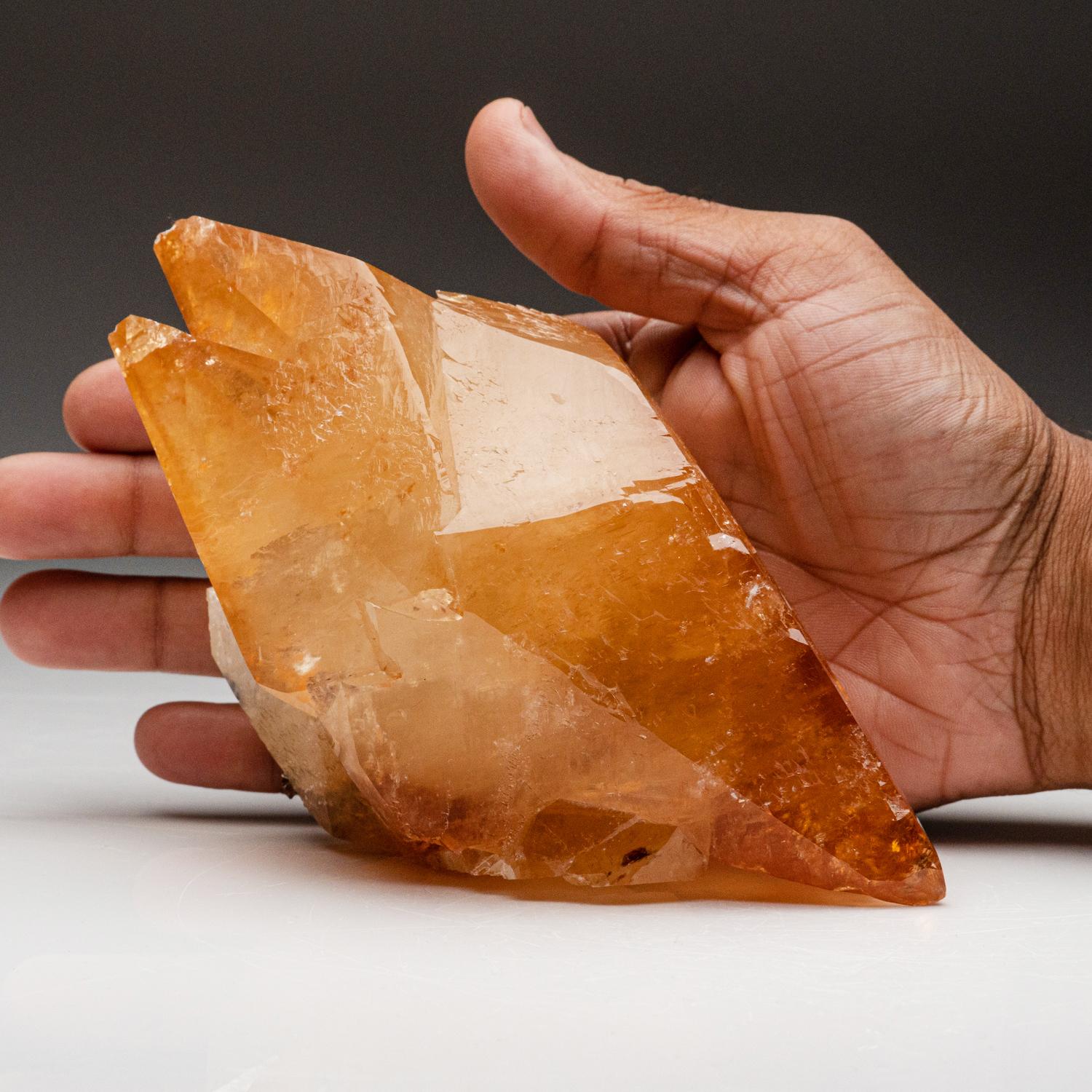 Lustrous transparent deep golden calcite crystal on matrix. Large double terminated scalenohedral twinned on the C-axis with well defined re-entrant faces. Small sphalerite crystal embedded on the back of the specimen.


1.9 lbs, 6.5 x 4 x 3 inches