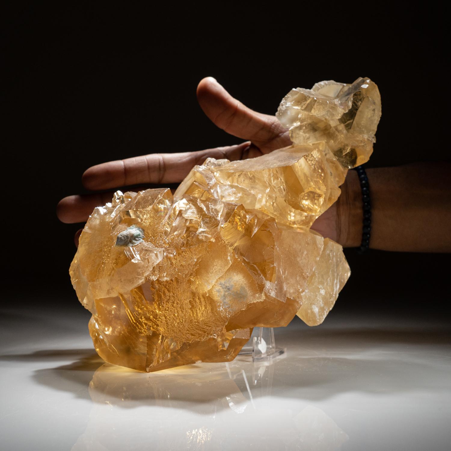 From Tieshan District, Huangshi Prefecture, Hubei Province, China

Lustrous translucent large blocky golden rhombohedral crystals of calcite in a stacking formation. The calcite crystals have a rich golden color with areas leading into a black