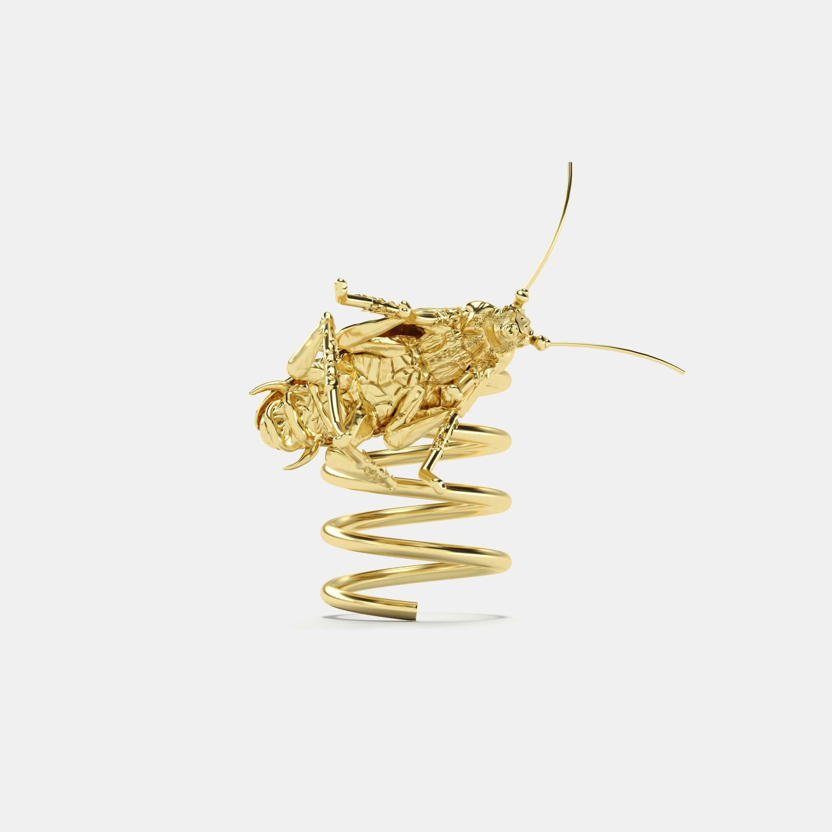 Golden Elastic Spiral Ring with Mambo Cockroach, 18k Yellow Gold.

ECH JEWELRY, Ode to the Revolution in Fine Jewelry!  
For everyday wear, the owner can easily remove the Cockroach using a special screwdriver that goes together with the ring.
This
