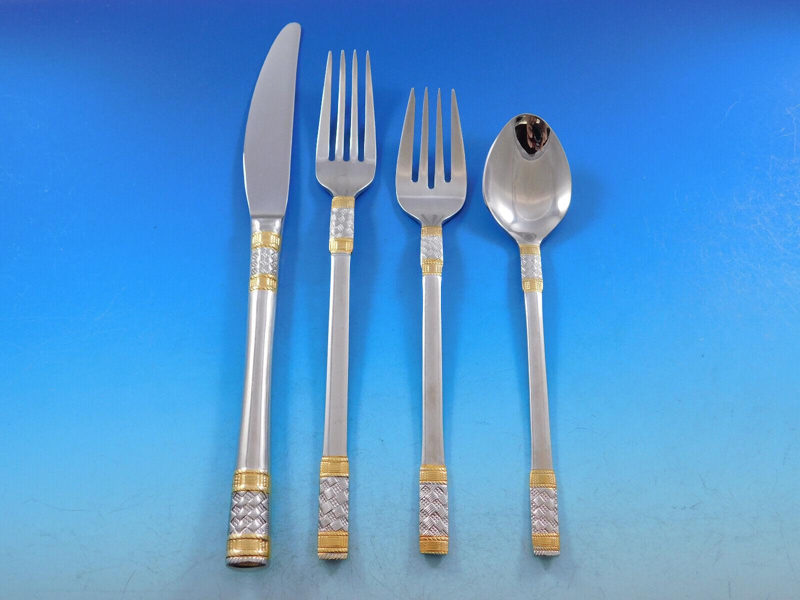 Golden Corsica 18/10 stainless steel flatware set, 53 pieces. This is Wallace's stainless with gold accent version of the sterling Golden Aegean Weave pattern. This set includes:

8 Dinner Knives, 9 1/2