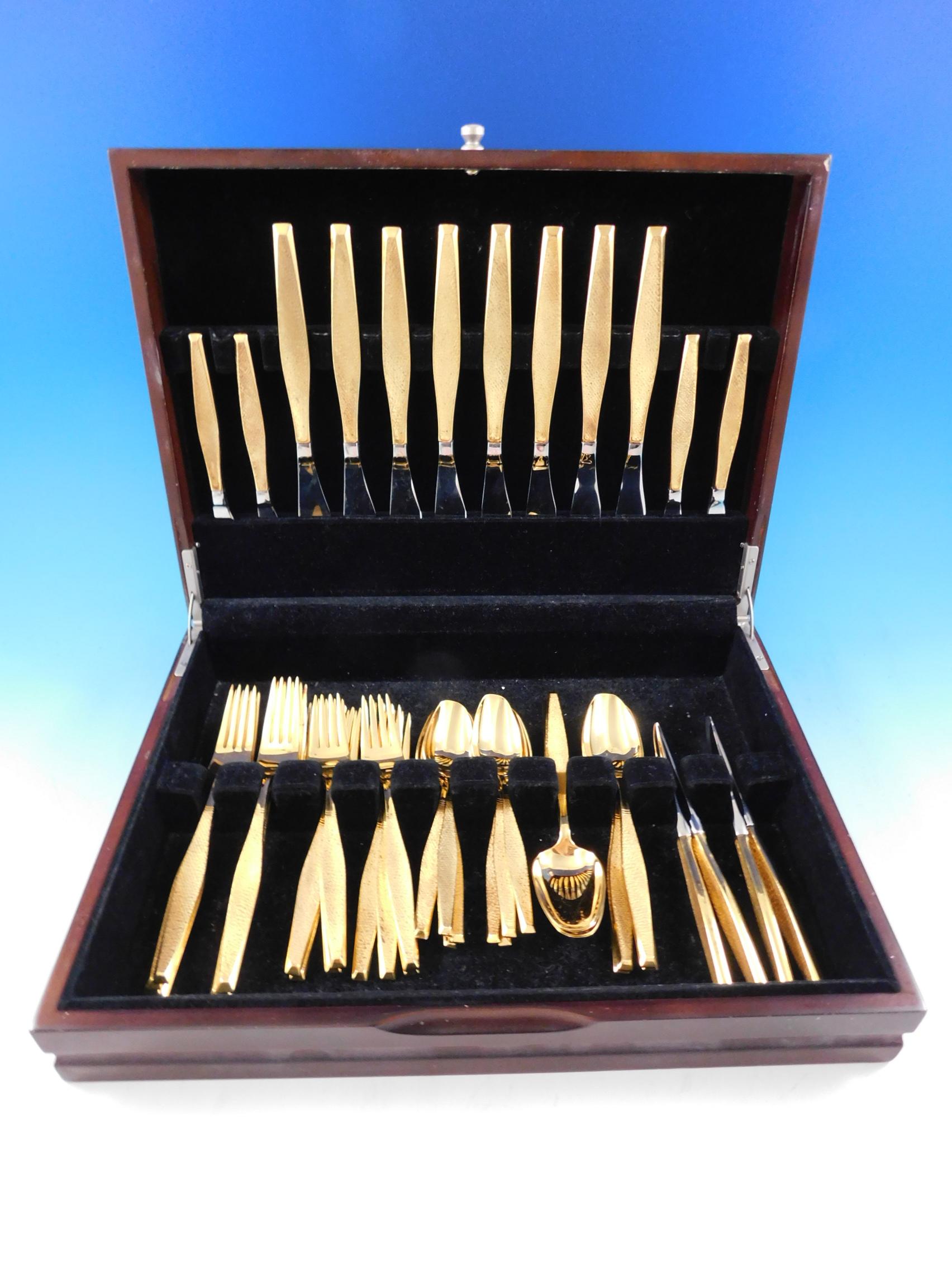 Scarce Mid-Century Modern Golden Damascene by Gorham sterling silver vermeil Flatware set - 48 pieces. This set includes:

8 knives, 9