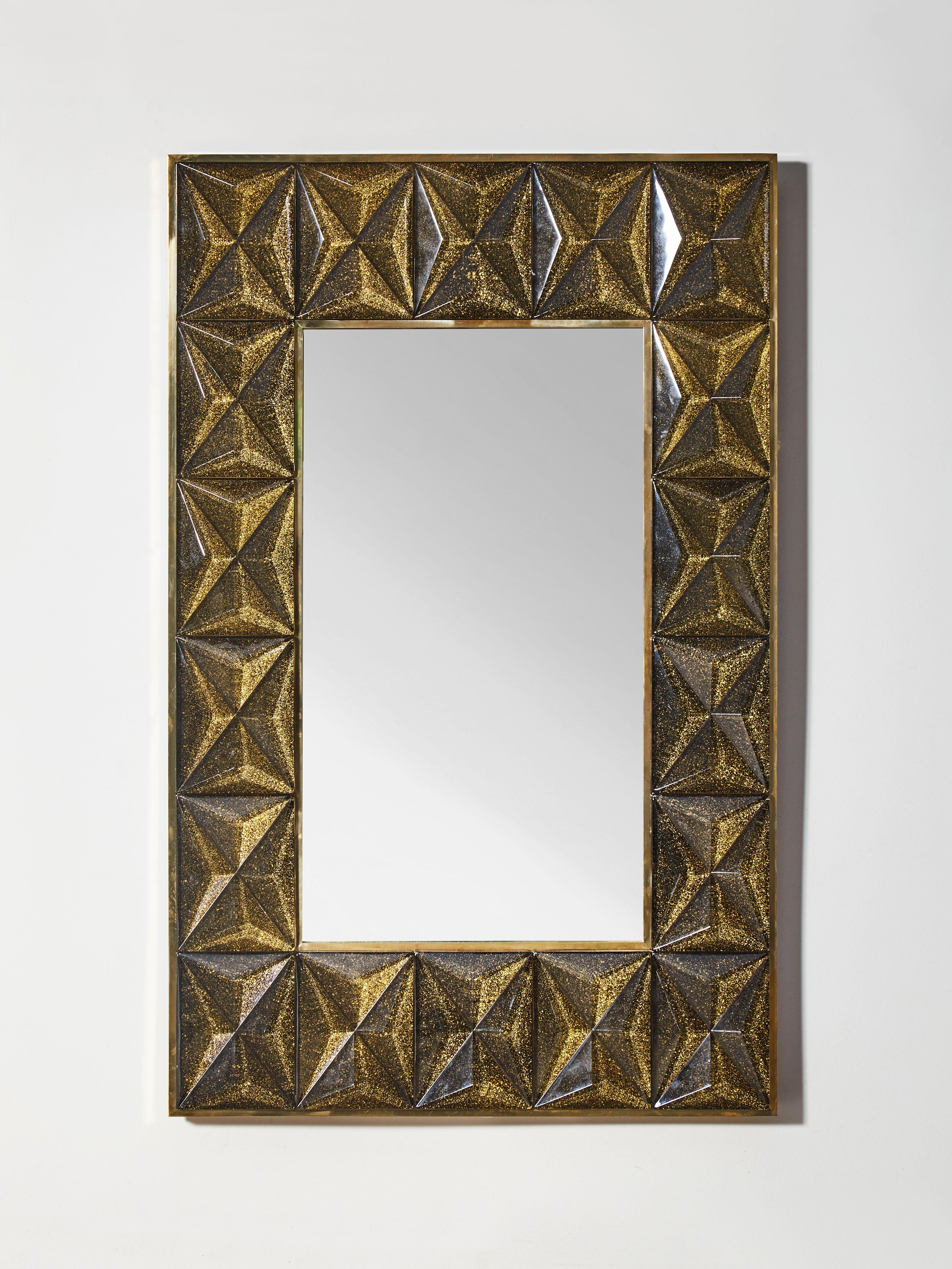Mirror with frame made of brass and sculpted golden 