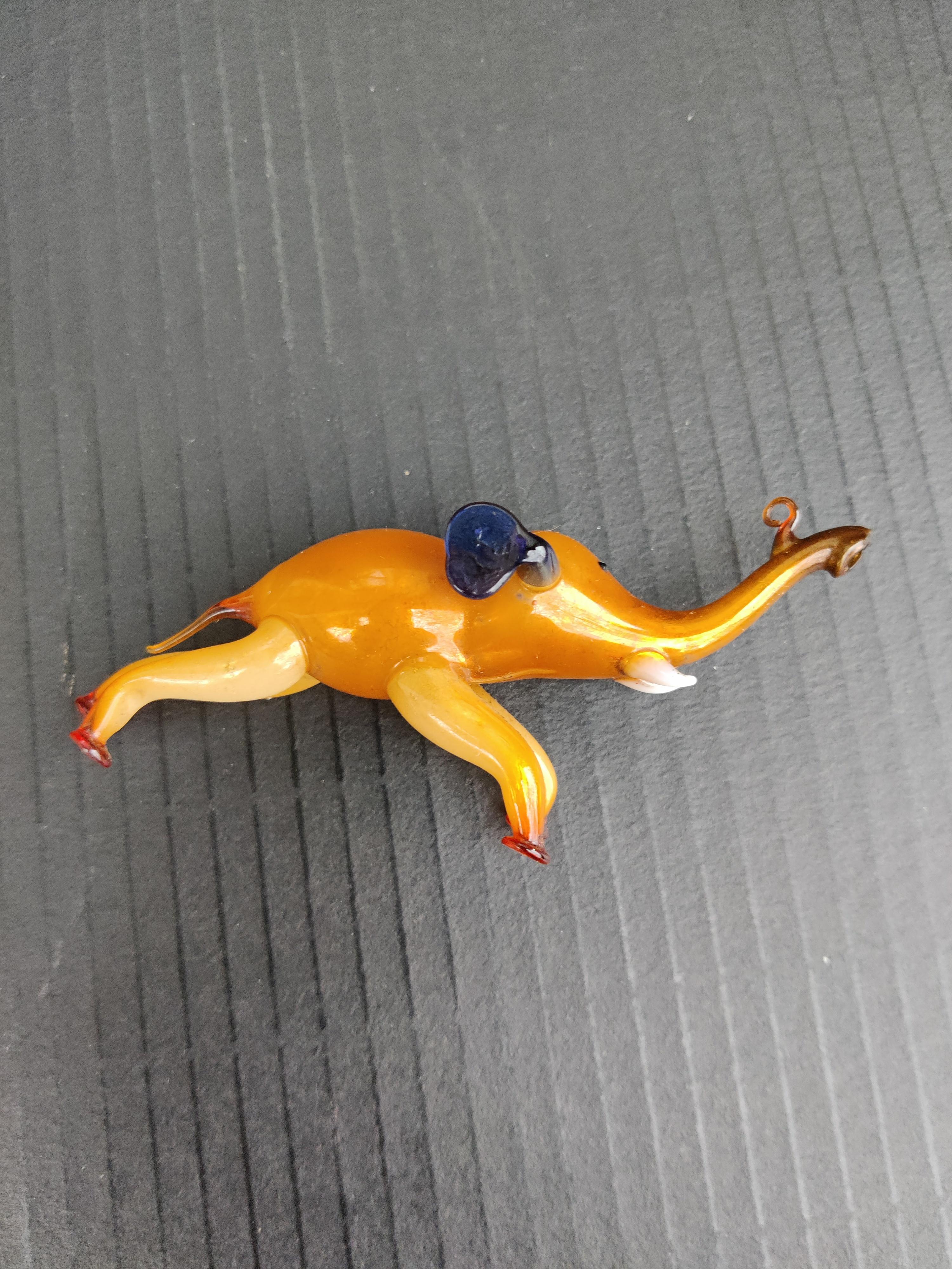 Golden Elephant with Blue Ears and White Tusk German Blown-Glass Ornament
Holder on trunk for ornament hook