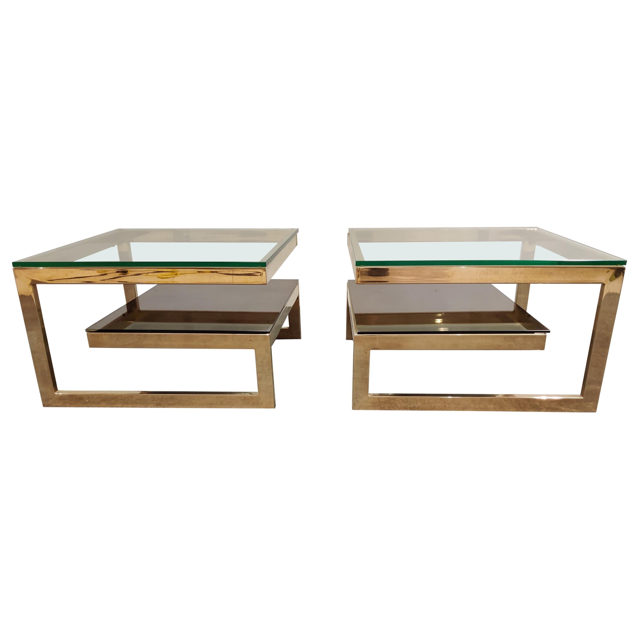 Pair of 23-karat gold layered 'G'-shaped side tables produced by Belgochrom.

The tables have clear and mirrored glass tops.

Good condition, original glass.

1970s, Belgium

Measures: Height 37cm/14.56
