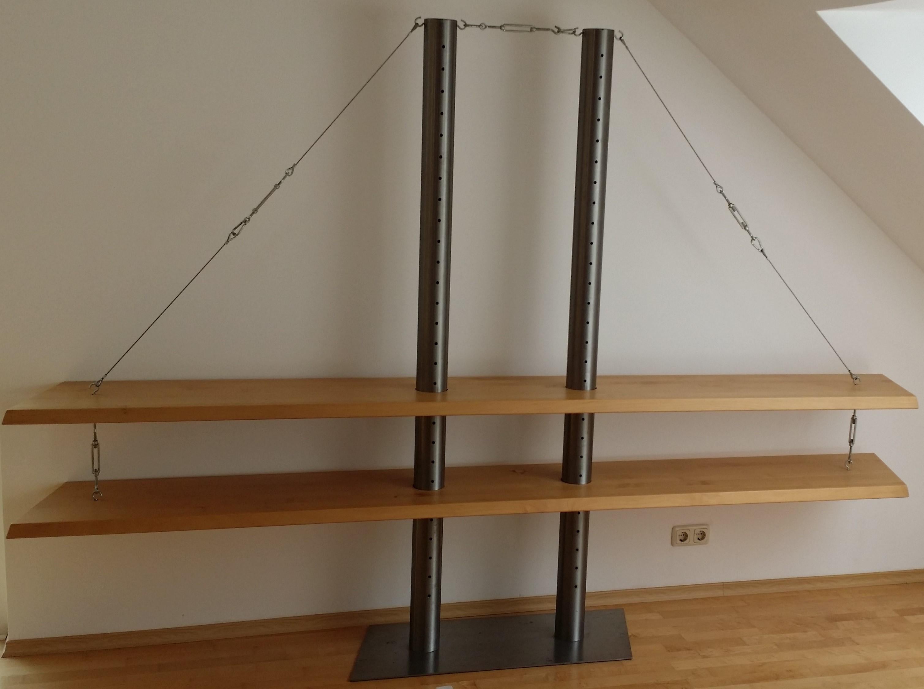 Wonderful standing shelf modeled after the Golden Gate Bridge.
Designed by an artist from Muenster / Germany as an absolute unique single piece - there is no second one in the world.
The shelf consists of a stainless steel base, two stainless