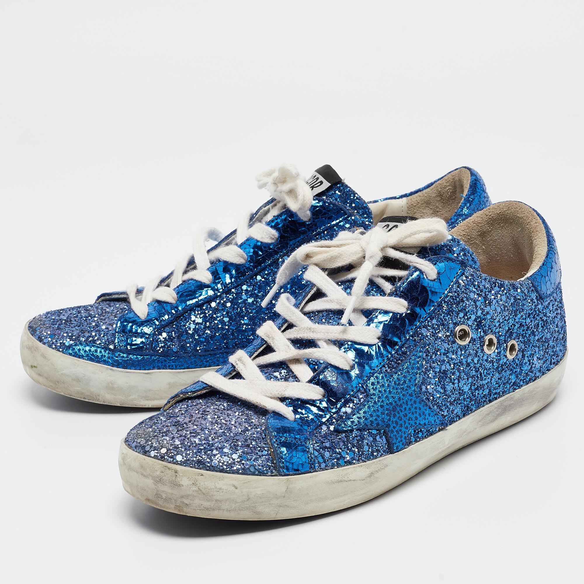 Coming in a classic silhouette, these designer sneakers are a seamless combination of luxury, comfort, and style. These sneakers are finished with signature details and comfortable insoles.