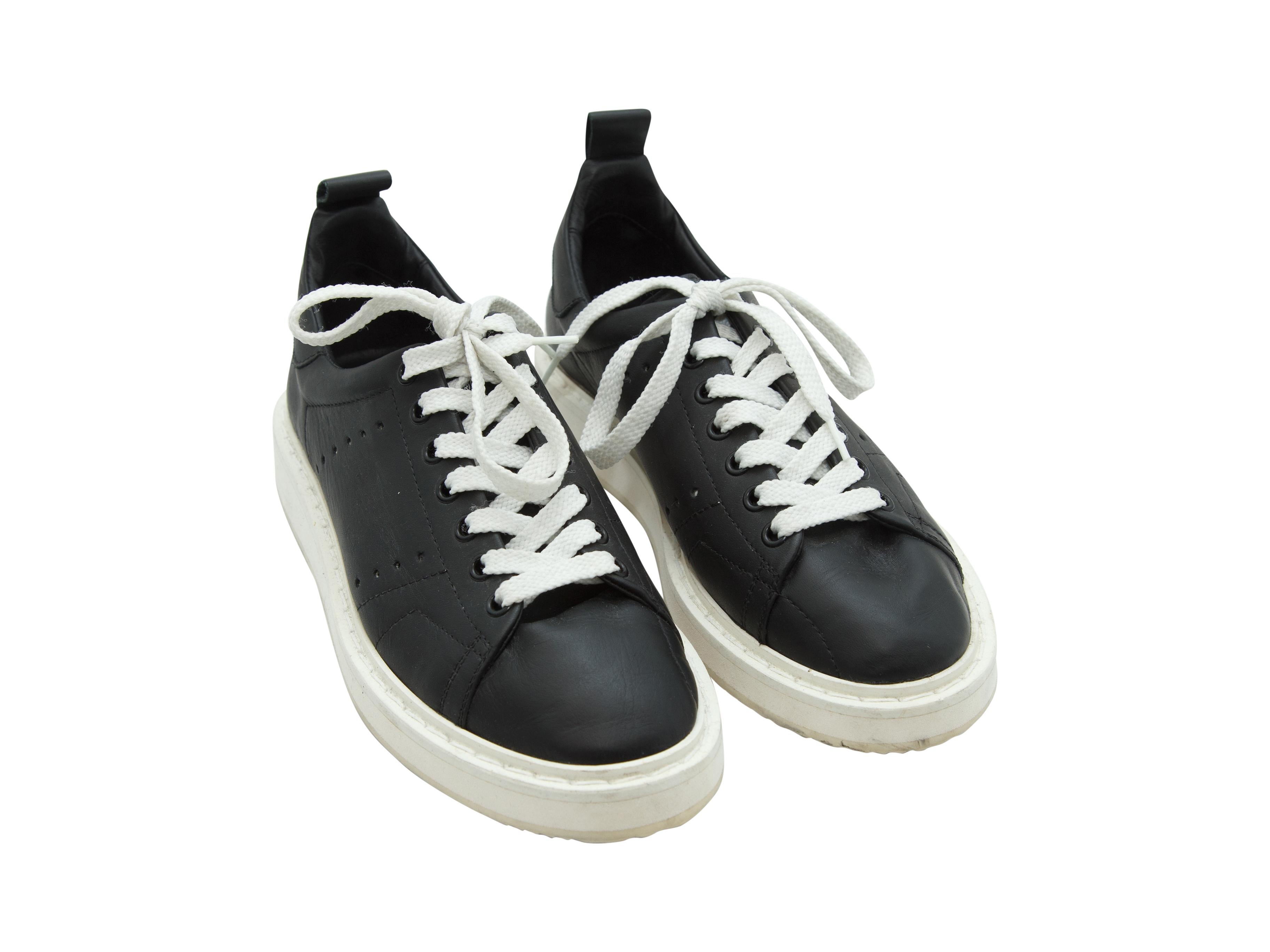 Product details:  Black leather sneakers by Golden Goose Deluxe Brand.  Lace-up closure.  Round toe.  
Condition: Pre-owned. Very good. 
Est. Retail $ 895.00