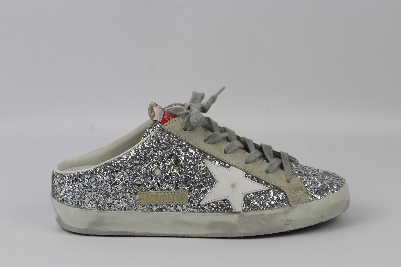 Golden Goose Deluxe Brand glittered leather and suede slip on sneakers. Silver, ecru, grey and white. Slip on. Does not come with dustbag or box. Size: EU 38 (UK 5, US 8). Insole: 9.9 in. Heel Height: 1.6 in. New without box