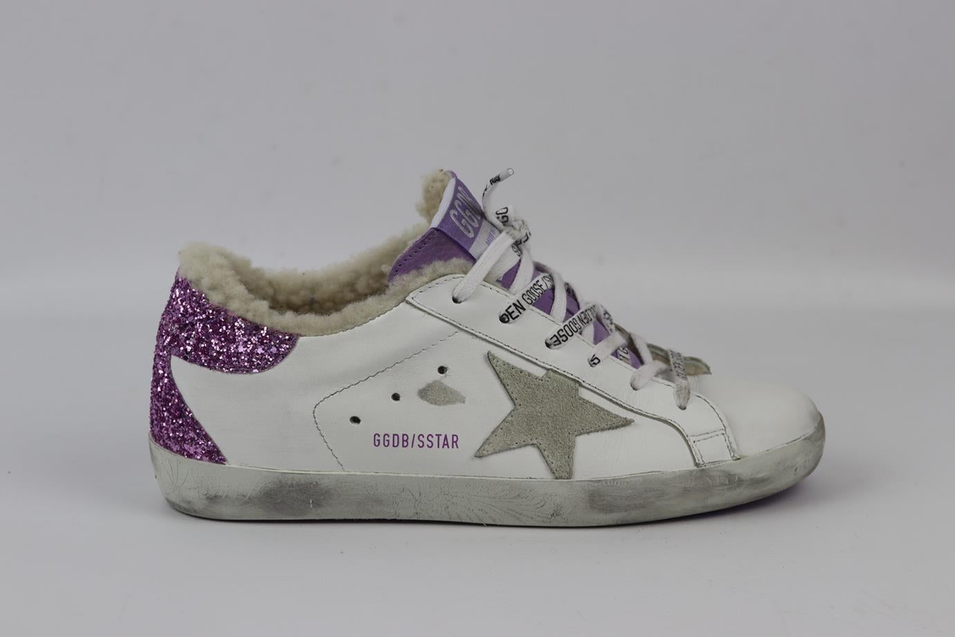 Golden Goose Deluxe Brand Superstar shearling lined leather sneakers. Purple, white and ecru. Lace up fastening at front. Does not come with dustbag or box. Size: EU 38 (UK 5, US 8). Insole: 9.8 in. Heel Height: 1.2 in. Very good condition - Worn