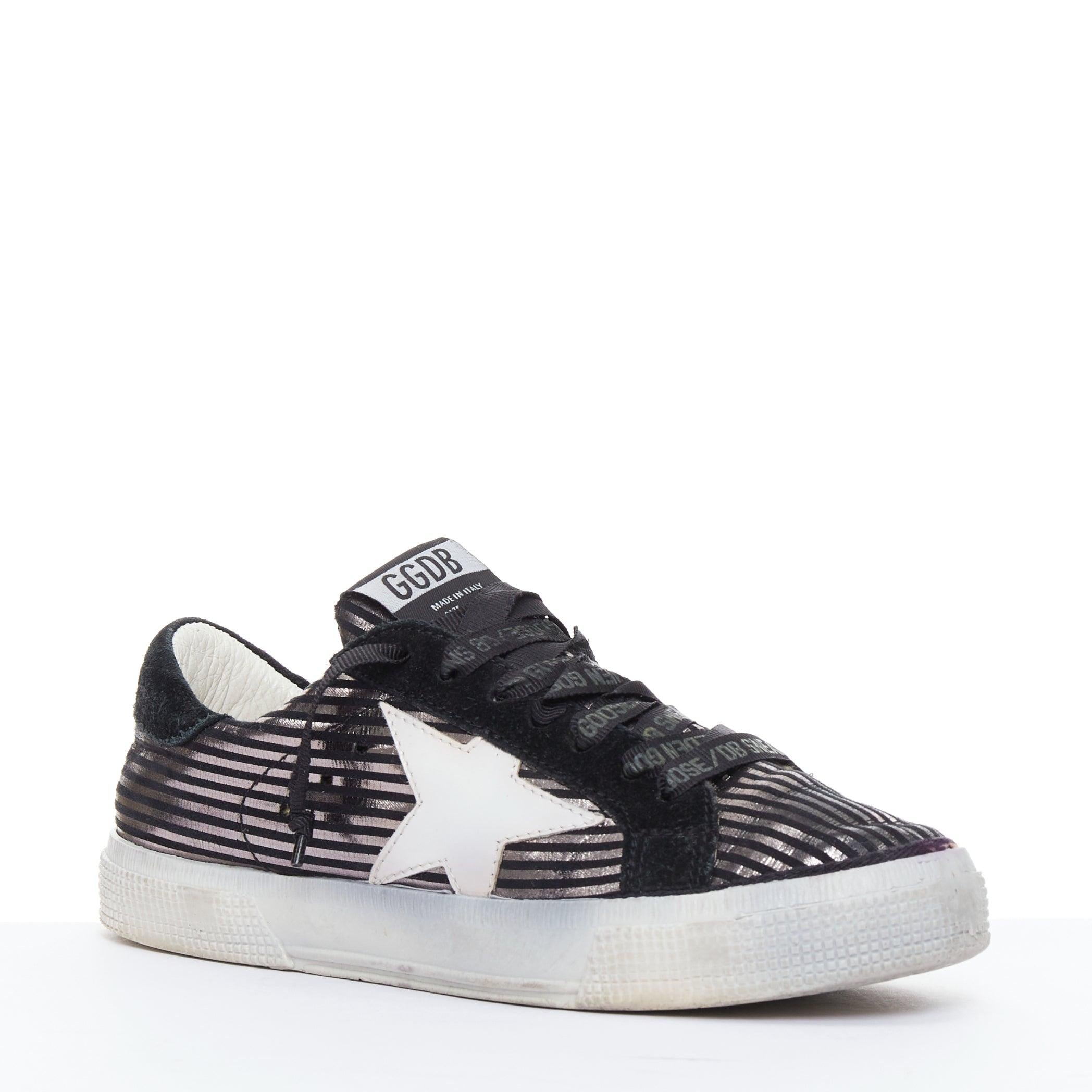 GOLDEN GOOSE Fancy metallic silver black stripe distressed sneakers EU36
Reference: LAYU/A00024
Brand: Golden Goose
Model: Fancy
Collection: Deluxe Brand
Material: Leather
Color: Black, Silver
Pattern: Striped
Closure: Lace Up
Lining: Cream