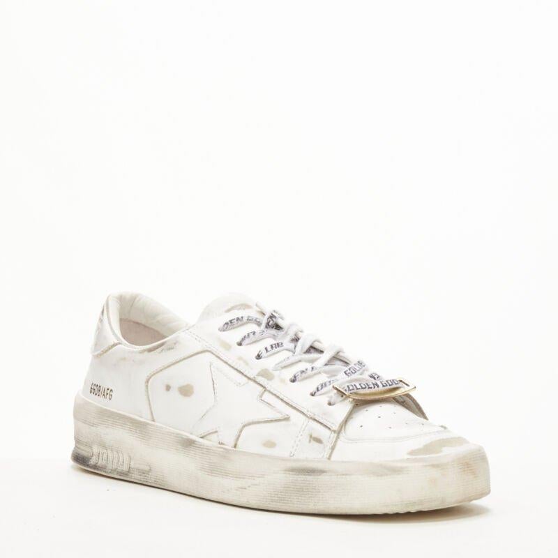 GOLDEN GOOSE GG/AFG Stardan distressed white low top sneaker EU38
Reference: KEDG/A00203
Brand: Golden Goose
Model: GGDB/AFG
Material: Leather
Color: White
Pattern: Solid
Lining:  Fabric
Made in: Italy

CONDITION:
Condition: Excellent, this item was