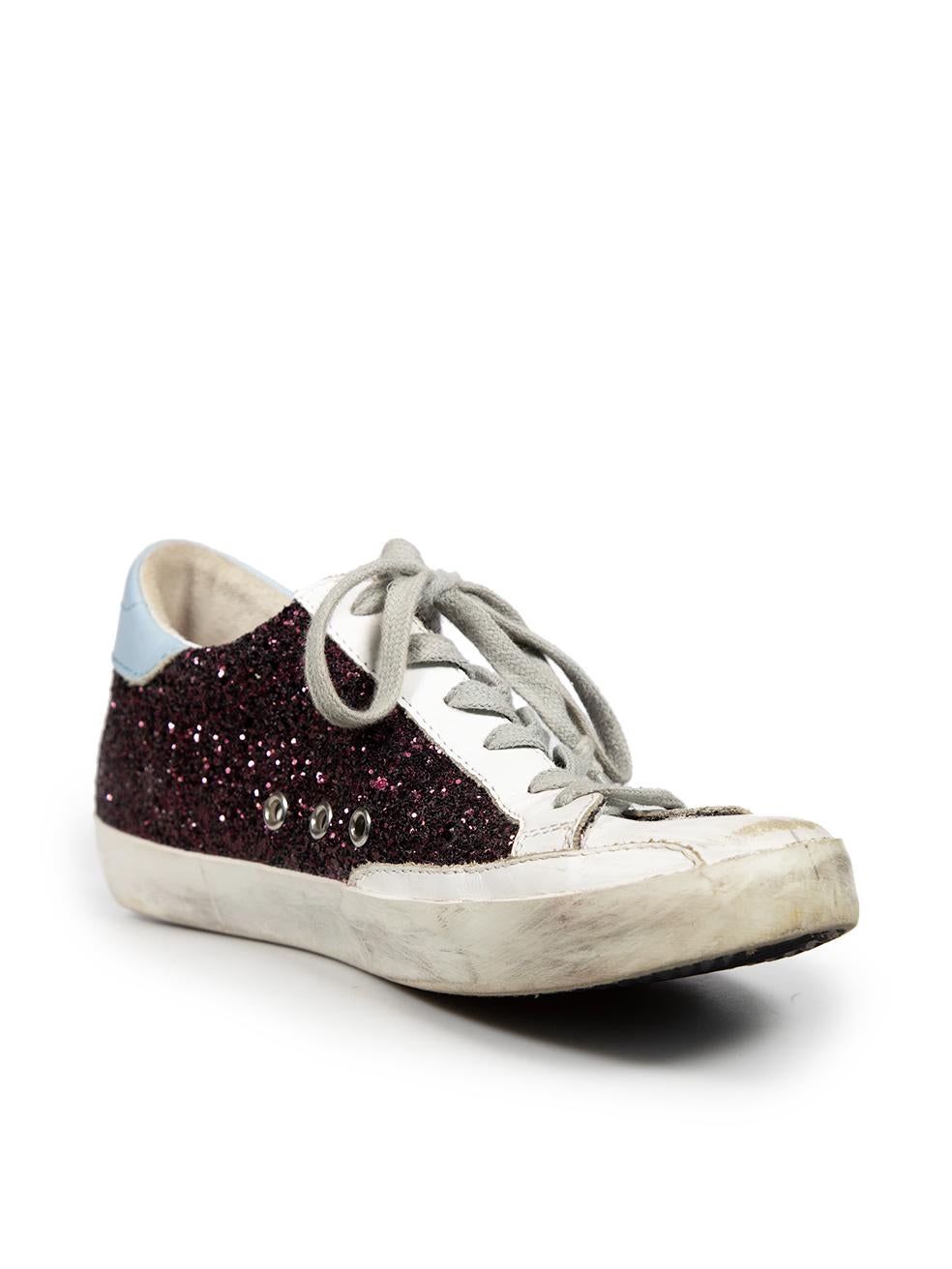 CONDITION is Good. General wear to the trainers is evident. General creasing to the leather on the vamp of both shoes. Abrasion to the counter on the right shoe and back rim of both shoes on this used Golden Goose designer resale item. Please note