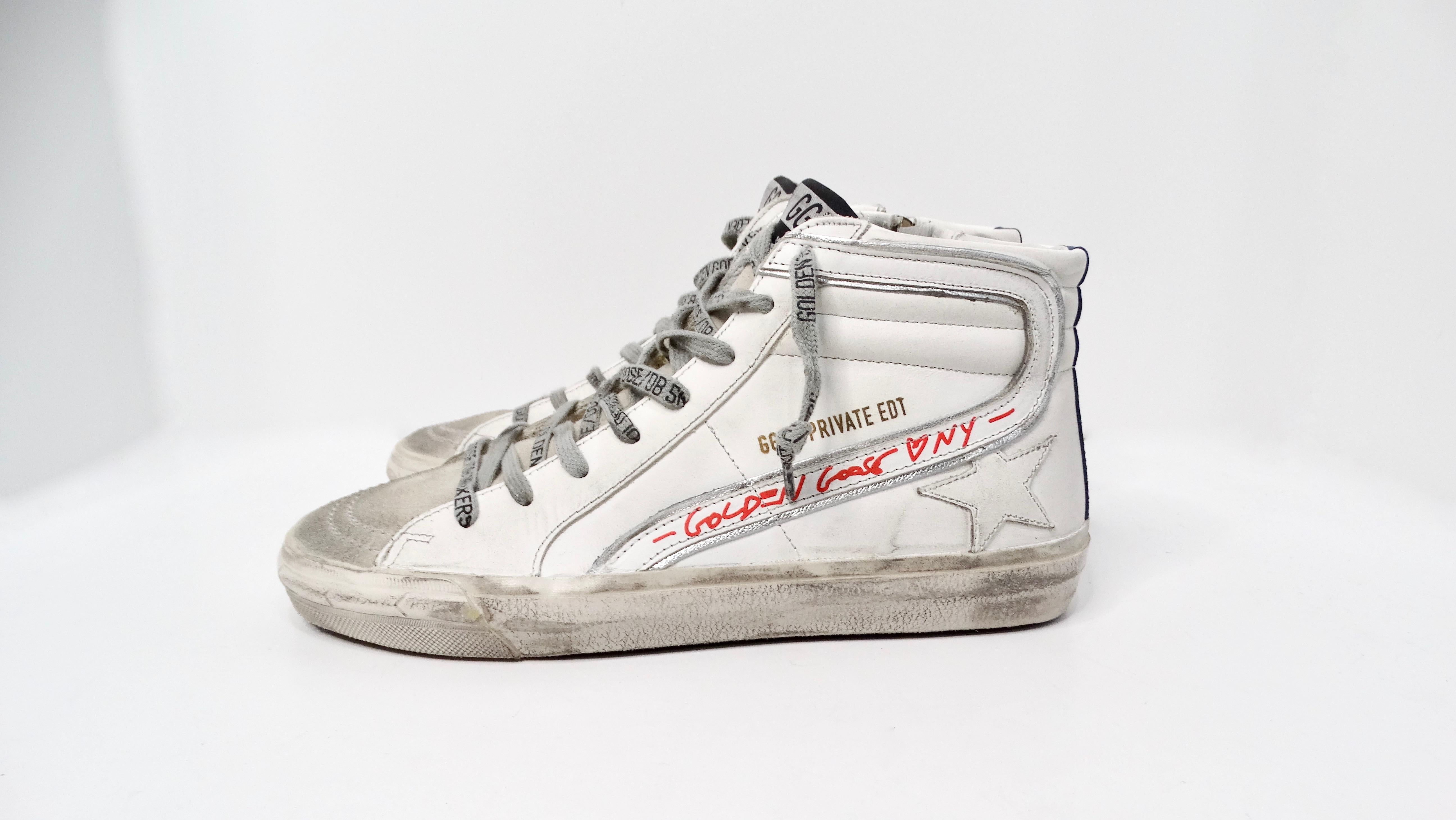 The Golden Goose I LOVE NY Hightop Distressed Leather Sneakers are a captivating blend of luxury and urban flair, paying homage to the bustling spirit of New York City. Crafted from premium white distressed leather, these high-top sneakers feature