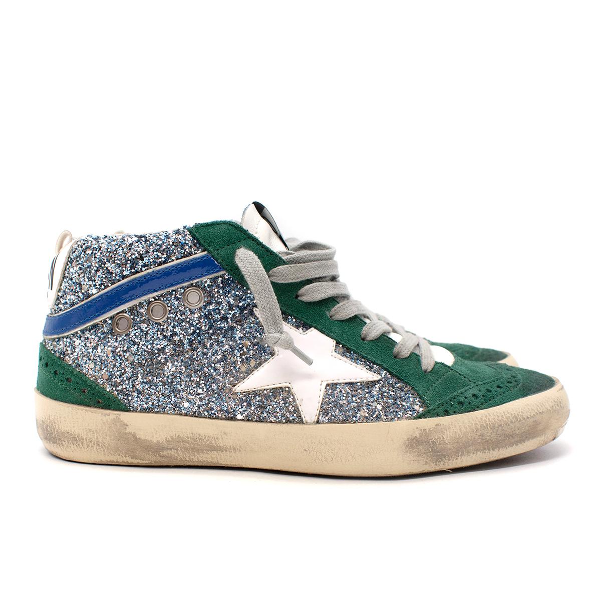 Golden Goose Mid Star Green Suede & Silver Glitter High Top Trainers
 

 - Cult Mid Star style, with green suede upper contrasted with textured silver glitter side panels embellished with the signature GGDB star in white leater
 - Logo branding to
