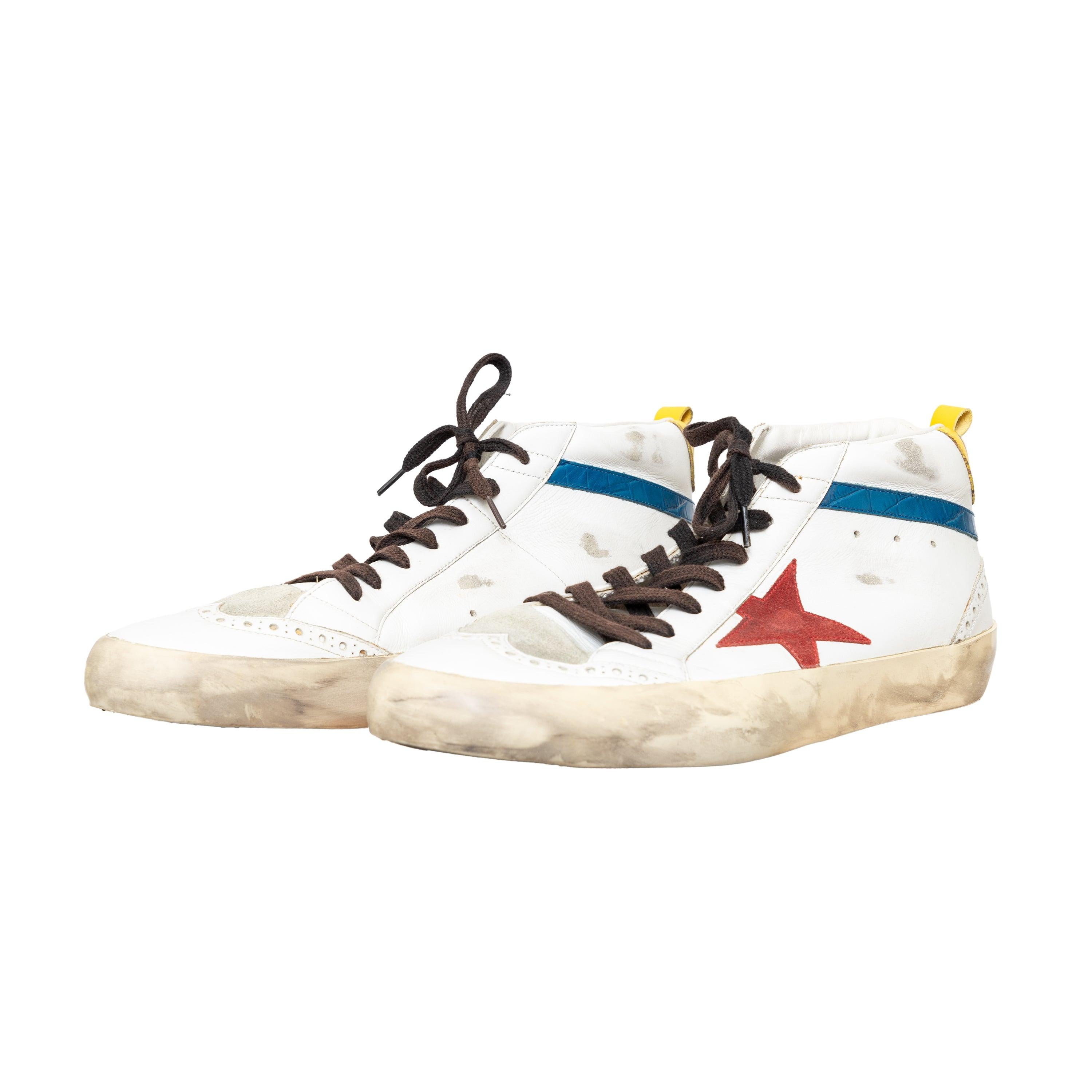 Distressed sneakers with vintage effect, logo details, contrasting accents, and suede elements in a sleek mid hi-top style for a contemporary look. 
 Measurement: Insole Length:29.5;Heel:3 
 Material: Leather