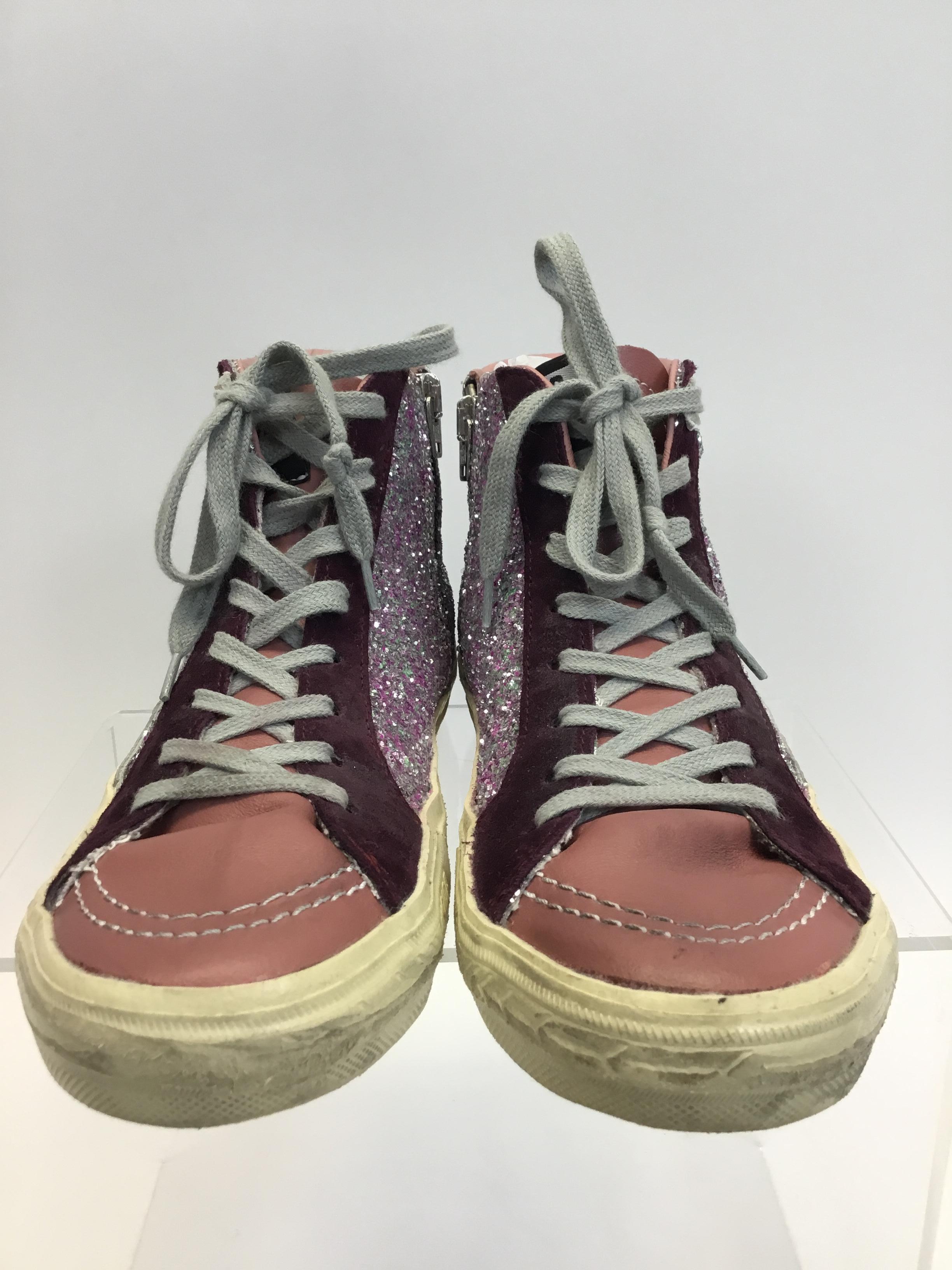 Golden Goose Pink Sparkle High Top Sneaker
$350
Made in Italy
Size 38
Side zipper closure